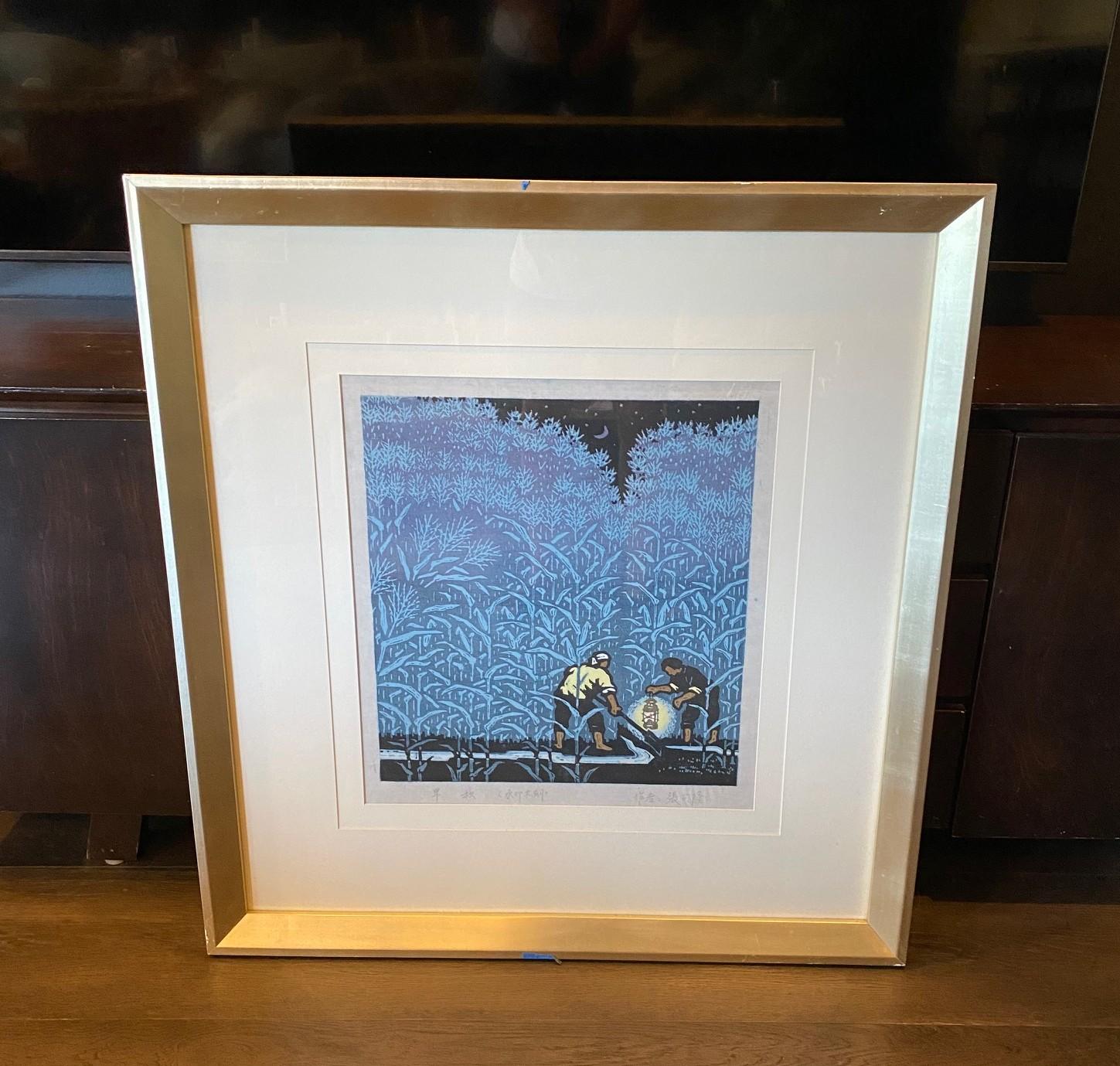 A beautiful Japanese style woodblock print by Chinese artist Ding Jitang (Ju Tang) featuring a rural peasant scene with two farmers working under a crescent moon by lamp light in the tall grass fields.  It is quite an arresting image.  The bold