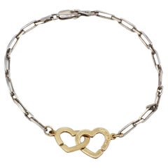dinh van double coeur Dinh Van 18 Karat Gold
Sterling Silver Double Heart Chain Link Bracelet