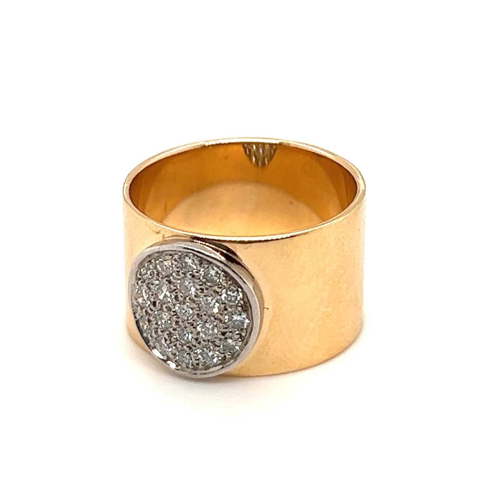 Very stylish 18 karat yellow gold platinum diamond band ring by Dinh Van.
Crafted in 18 karat yellow gold and designed as a wide band ring centered by a platinum disc set with brilliant-cut diamonds totalling circa 0.4 carats.
Jean Dinh Van is