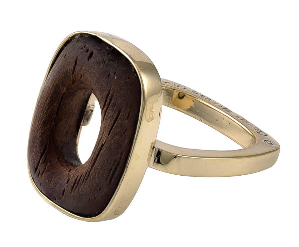 Chic gold and wood ring.  Made by DIHN VAN for CARTIER.  18K yellow gold with a cushion-shaped wood inlay.  Size 6 
and can be custom sized.  A distinctive statement.  

Alice Kwartler has sold the finest antique gold and diamond jewelry and silver