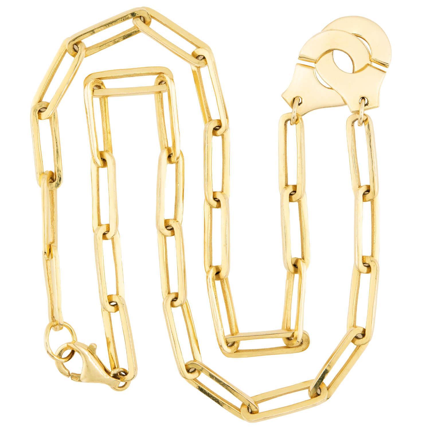 A fabulous and fashionable paperclip chain necklace! This wonderful piece is crafted in vibrant 14k yellow gold, and was designed to resemble the Menottes Dinh Van handcuff necklace. The piece is comprised of paperclip style links, which feature a