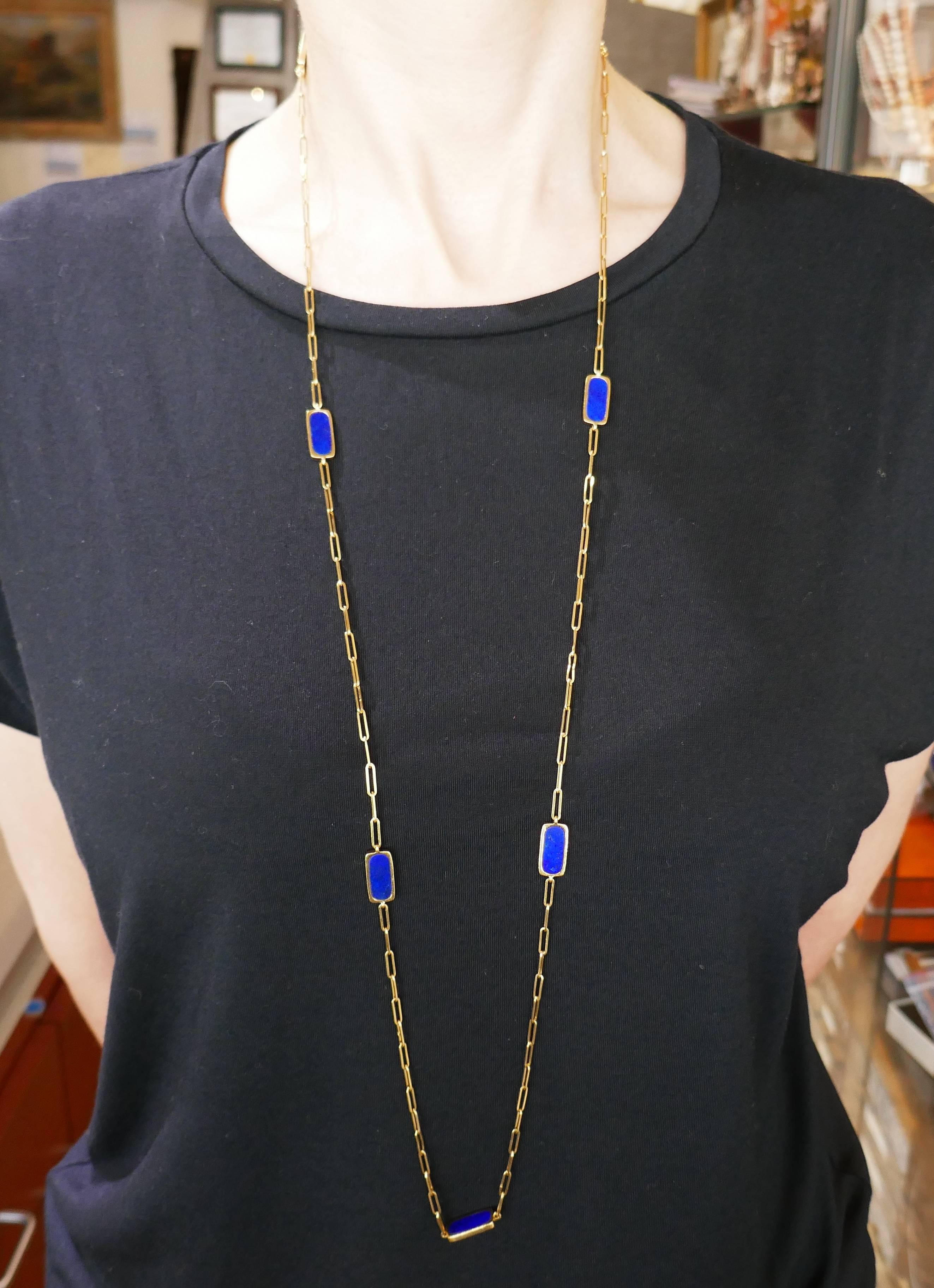 Chic and colorful necklace created by Dinh Van in 1971. Trendy, versatile and wearable, it is a great addition to your jewelry collection. 
The necklace is made of 18 karat yellow gold and lapis lazuli. 
The necklace is 39 inches (99 centimeters)