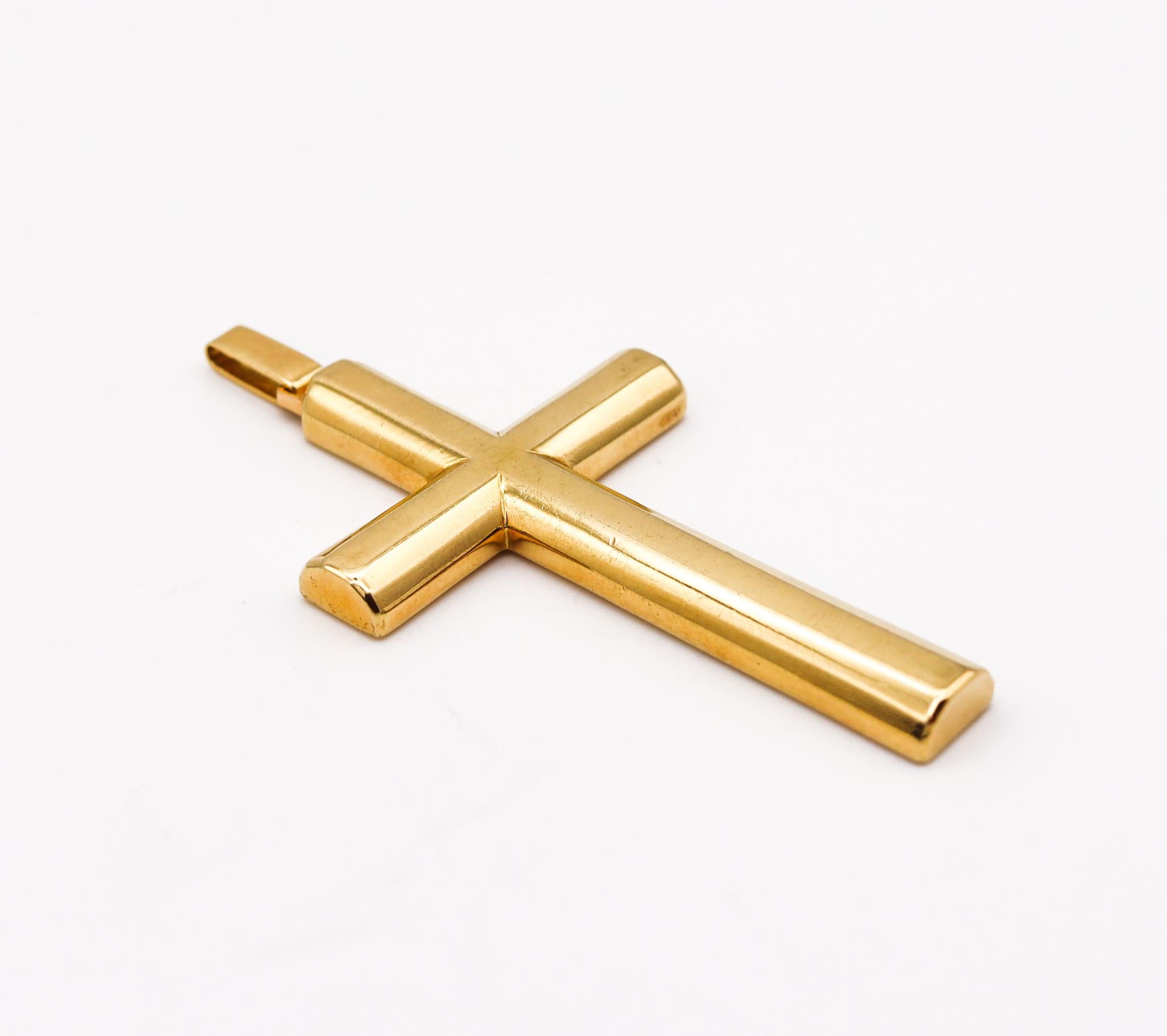 A geometric cross designed for Jil Sander by Jean Dinh Van.

Beautiful vintage piece, created in Paris France back in the 1980 at the atelier of the iconic jewelry designer Dinh Van. This geometric avant garde cross has been specially made in the