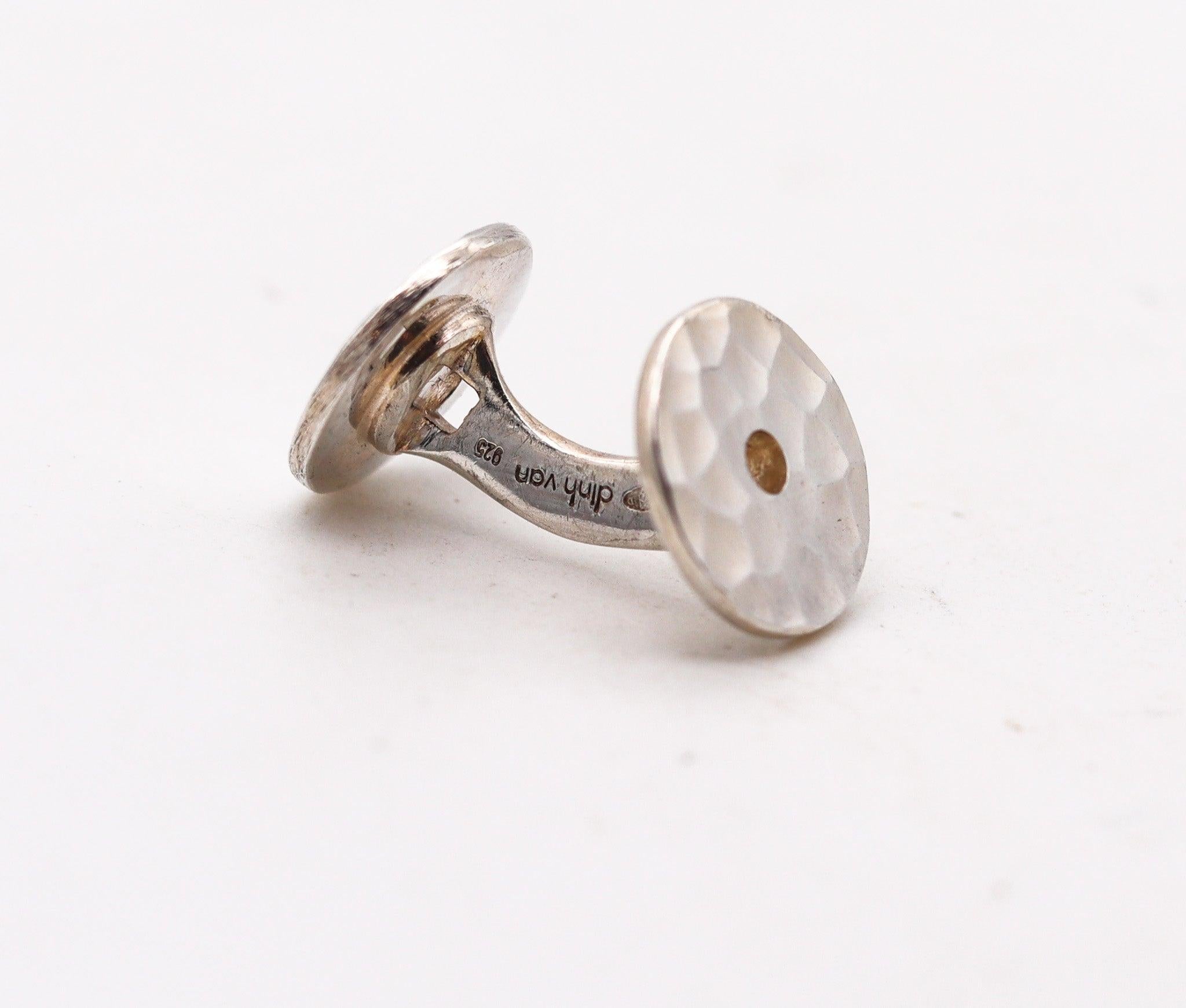 A pair of cufflinks designed by Dinh Van.

Beautiful pair of cufflinks, created in Paris France by the master jewelry designer Jean Dinh Van, back in the 1990. These iconic cufflinks are from the Dinh Van Pi collections, crafted in solid ,925/.999