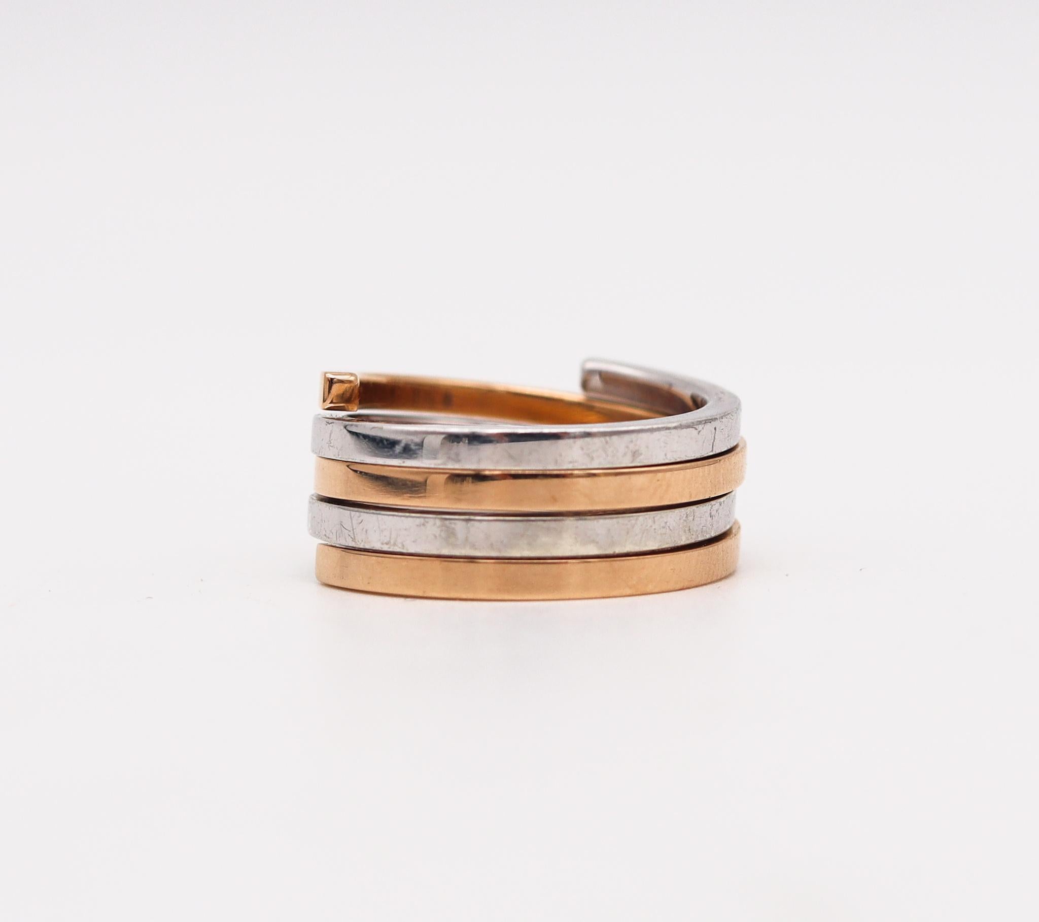 Geometric spirals rings designed by Jean Dinh Van.

Stunning geometric modernist piece, created in Paris, France at the jewelry atelier of the iconic designer Jean Dinh Van, back in the 1980's, This lovely duo spirals rings has been crafted in solid