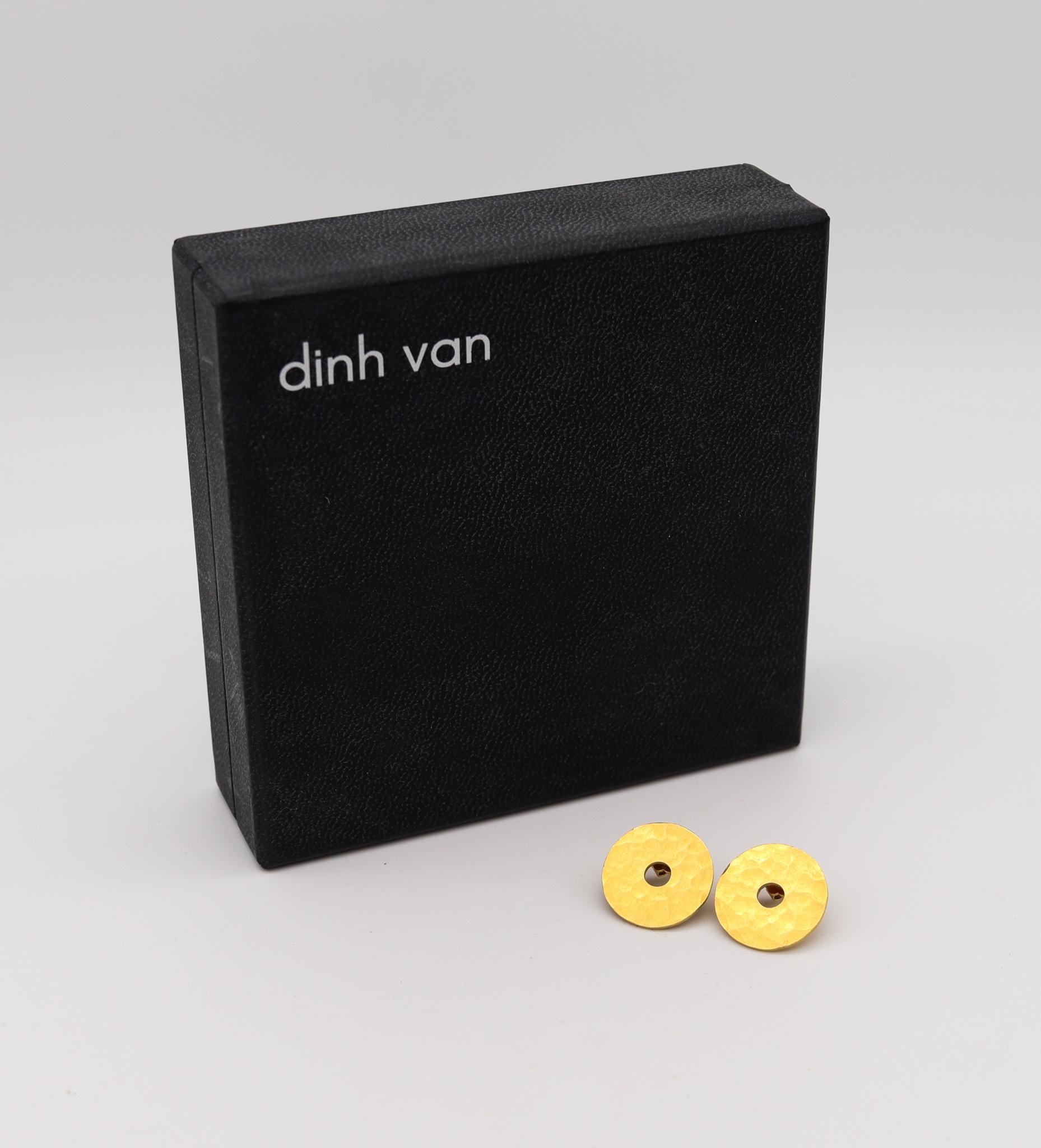 A geometric PI Chinois earrings designed by Jean Dinh Van.

Beautiful geometric circular pair, created in Paris, France at the jewelry atelier of the iconic designer Dinh Van. This pair of geometric studs earrings are from the PI CHINOIS collection