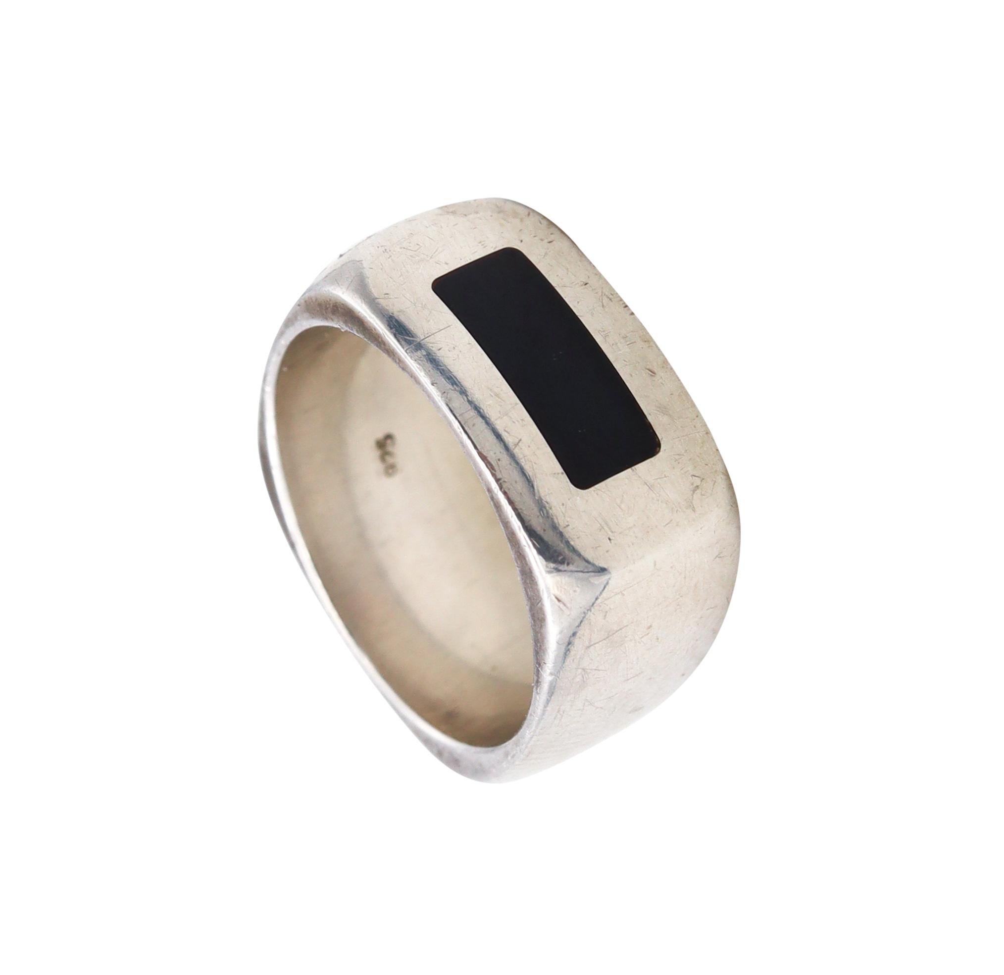 A geometric ring designed by Dinh Van.

Nice modernist band ring, made in Paris, France by the master jewelry designer Jean Dinh Van. It was crafted, with a cushioned shape in solid .925/1000 sterling silver.

Has a weight of 10.5 grams and the