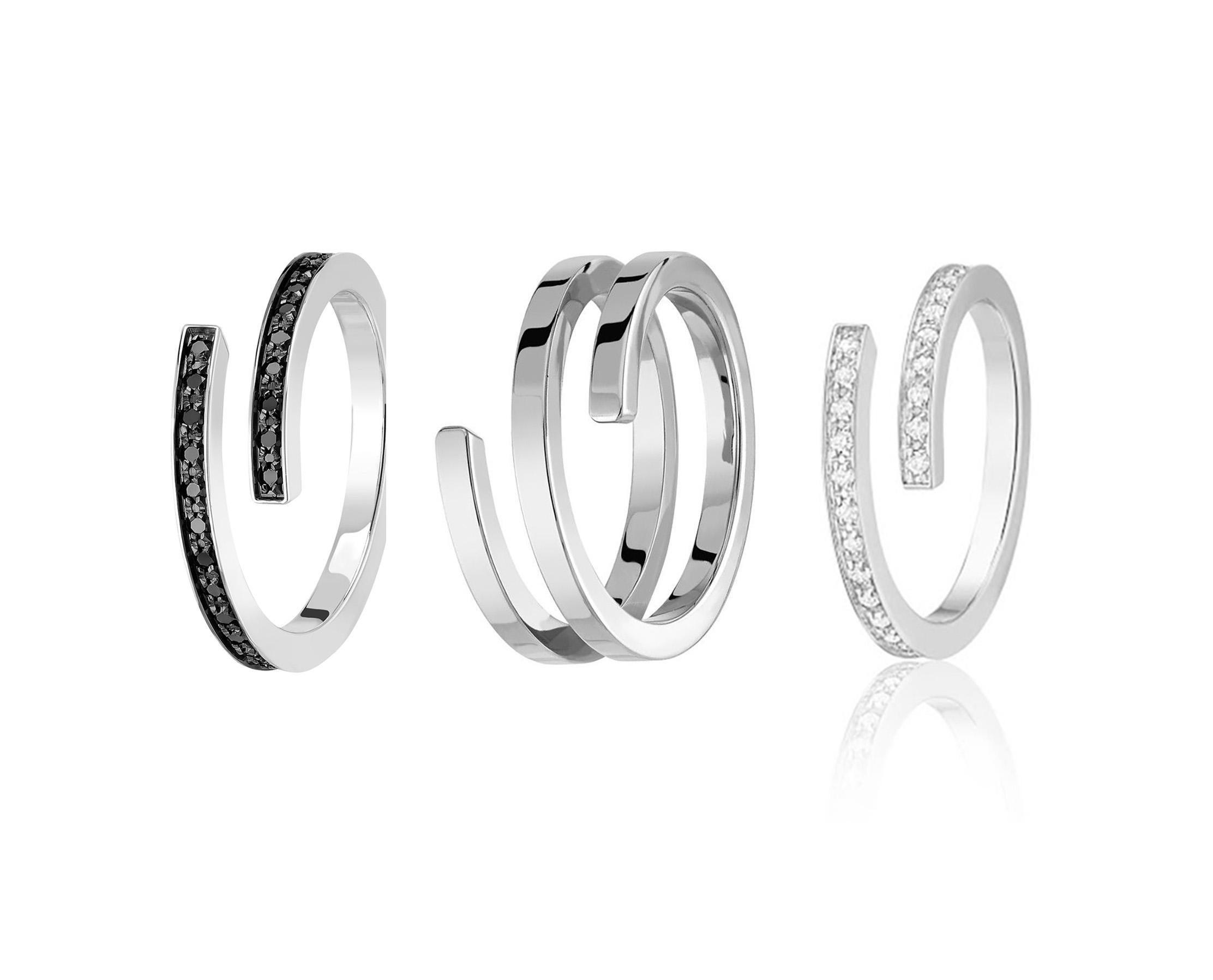 Set of 3 rings, a unique entwining design of 18kt gold rings. 

In this collection by french jeweller Dinh Van, multiple combinations of different materials, different designs as well as different sizes are for you to mix and match. Its designed