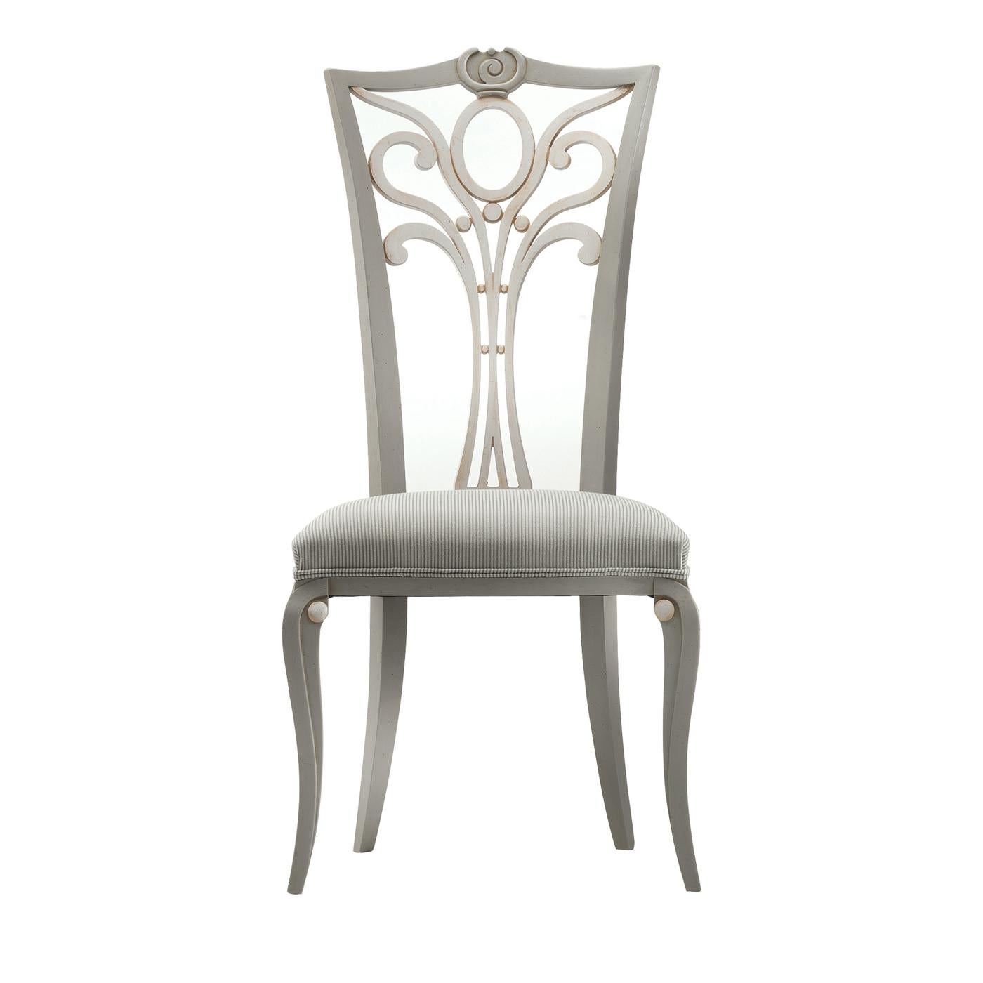 A refined design characterizes the Contemporary chair by Modenese Gastone. The structure is in white wood, while the soft seat is padded and upholstered with matching fabric. The finely decorated backrest makes this chair perfect for giving a touch