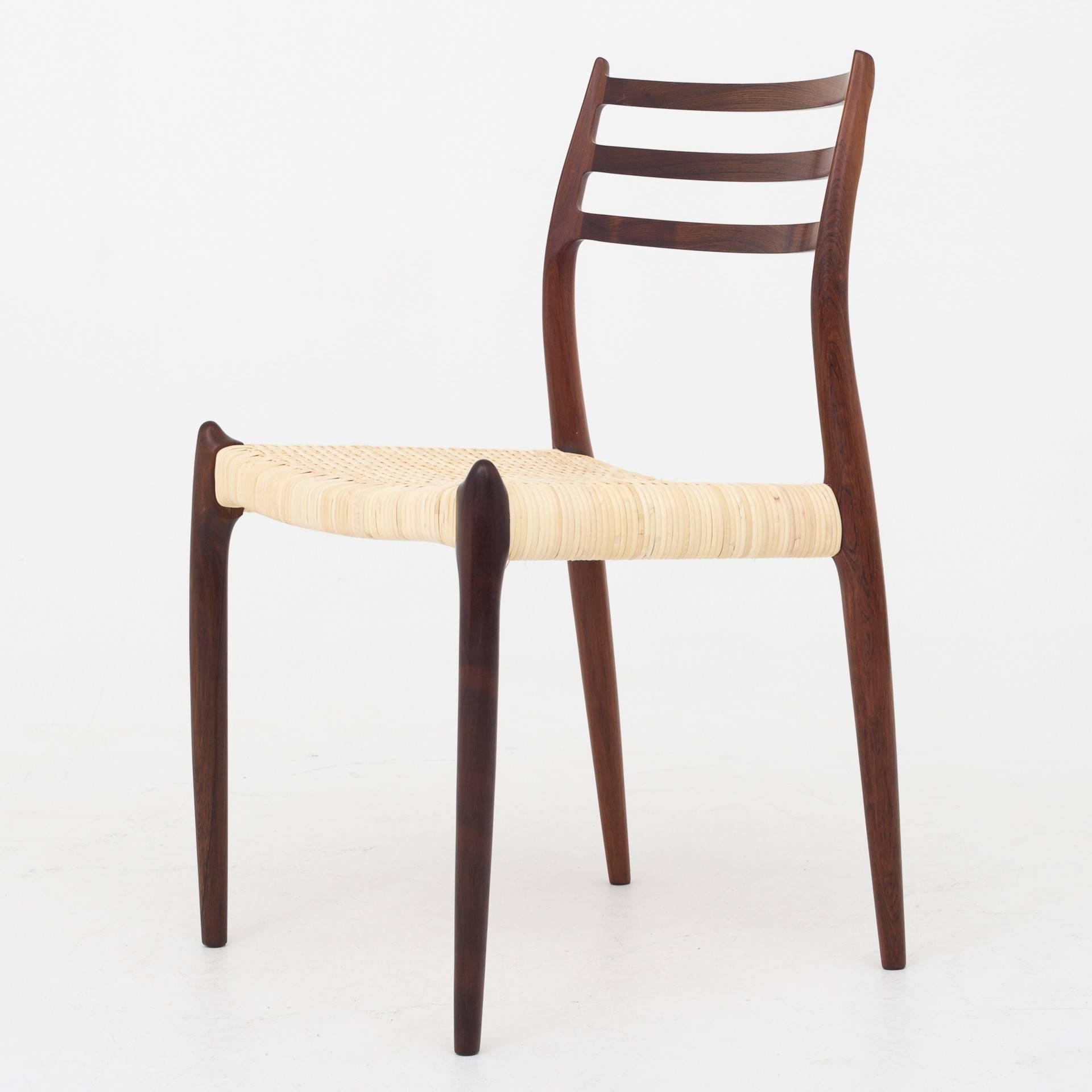 Seat of four no 78, dining chair in rosewood with new cane seat. More pieces in stock. Maker J. L. Møller.