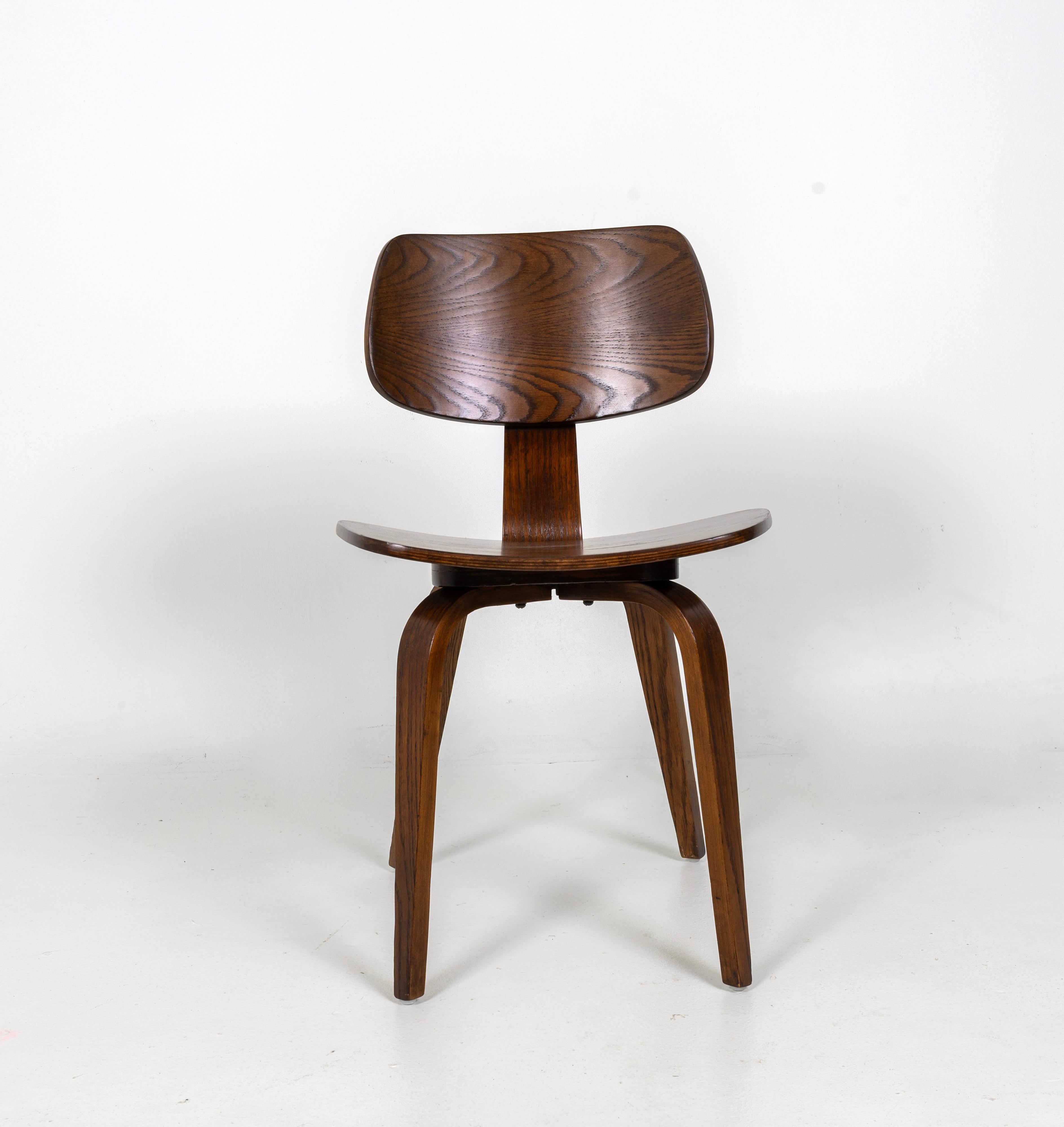 One Chair Designed by Bruno Weil for Thonet in the 1960s, oak plywood with a walnut lacquer finish. Ready for a new home, in total we have 12 Chairs available.