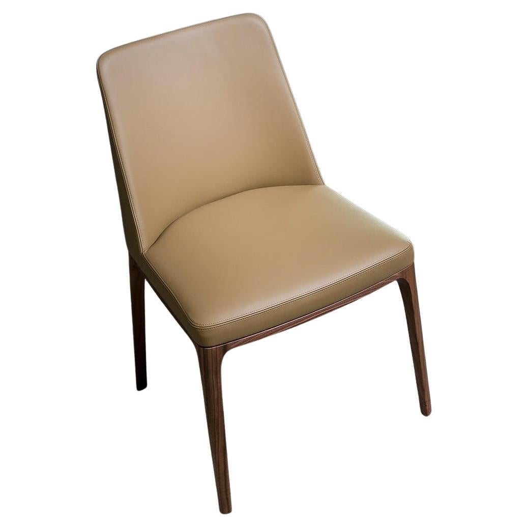 Hand-Crafted Dining Chair Featuring Solid Wood Legs and Upholstered in Leather For Sale