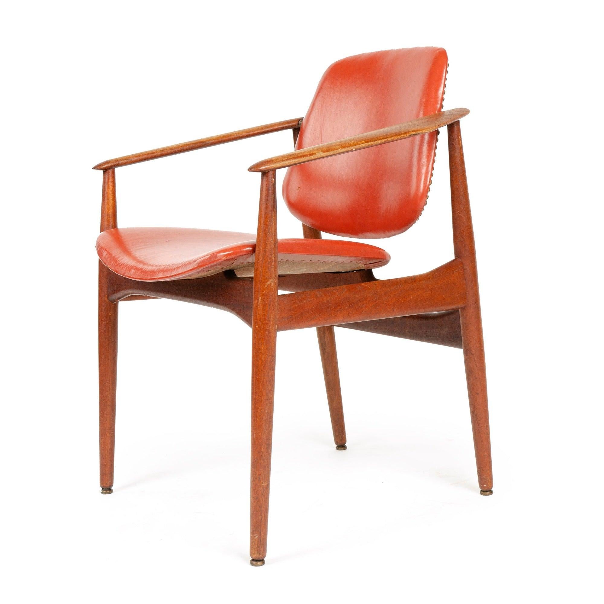 A dining chair having an exposed solid Bangkok teak frame supporting a wrapped molded seat and back, the back having a unique brass-hinged pivoting adjustment.