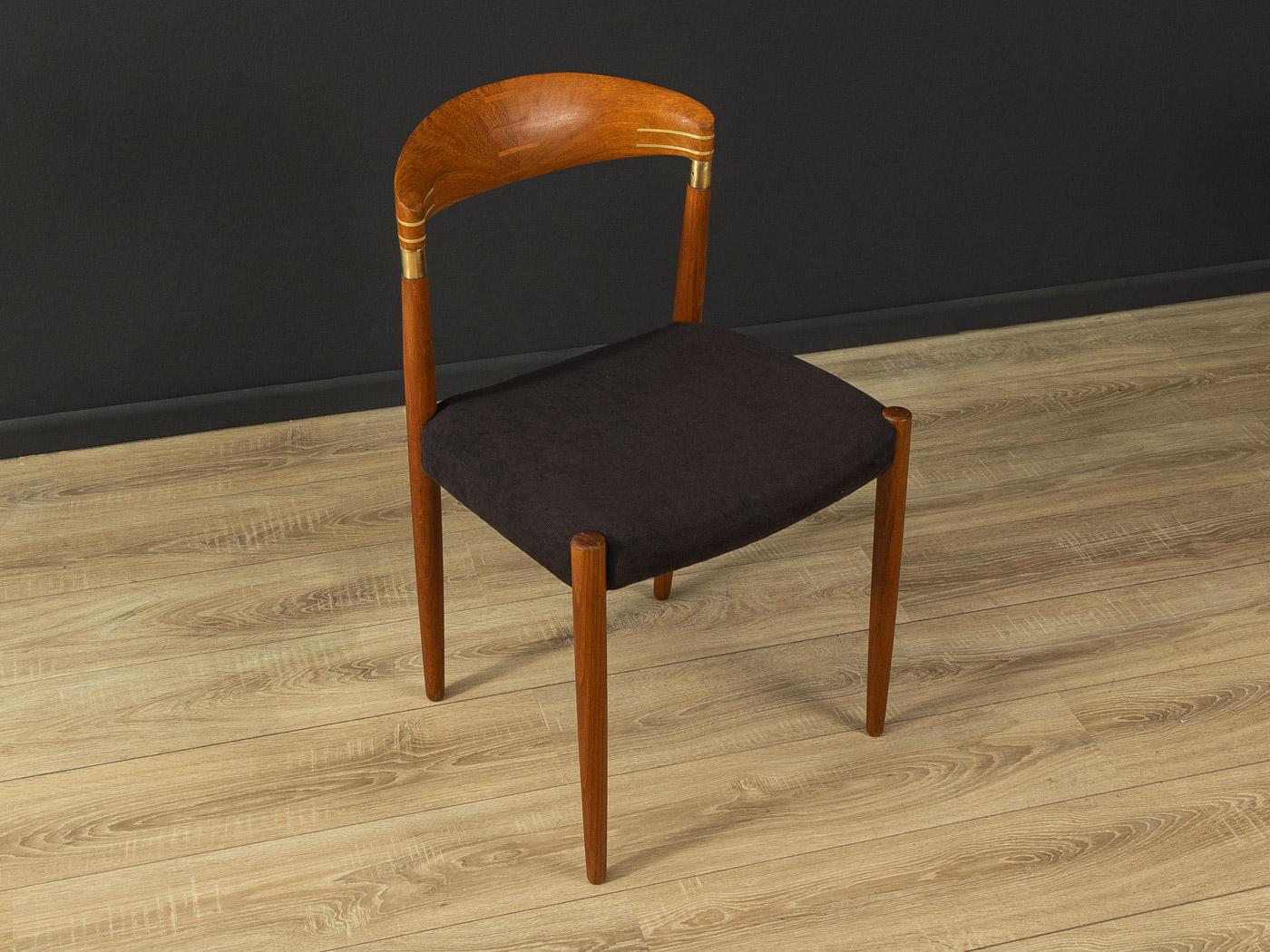 Rare Dining Chair by Knud Andersen for J.C.A. Jensen. High-quality teak frame with brass detailing. The chair has been re-upholstered and covered with a high-quality fabric in black. Made in Denmark (Branding on the frame).