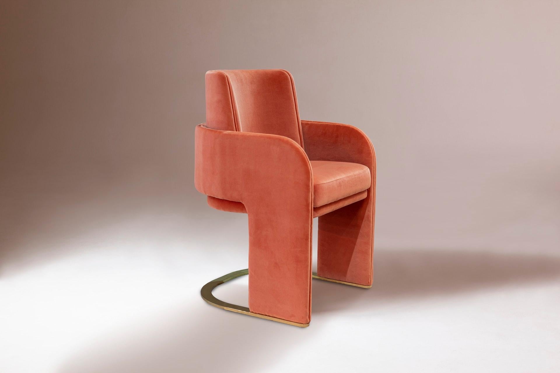 Beautiful dining chair with soft cotton velvet by Pierre Frey in Papaye color and polished brass foot. New and in stock, ready to ship. 

Odisseia chair embodies the aesthetic spirit of the Space Age, a new kind of discreet luxury and comfort