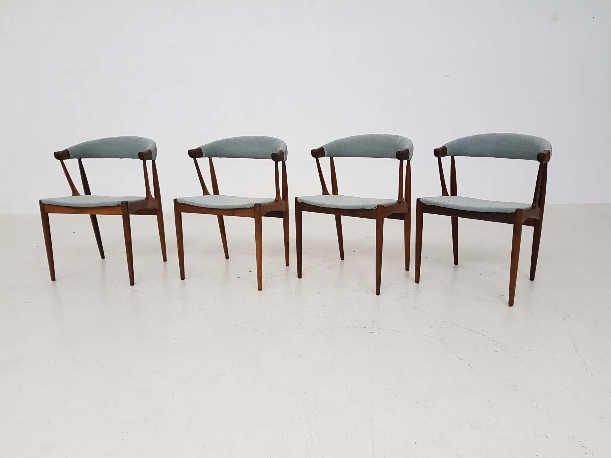 Set of 4 rosewood dining chairs by Johannes Andersen for Andersens Møbelfabrik, designed in Denmark in 1969.

This Danish modern set from the midcentury are made of beautiful rosewood and are newly upholstered in mint green fabric. 

They remind us