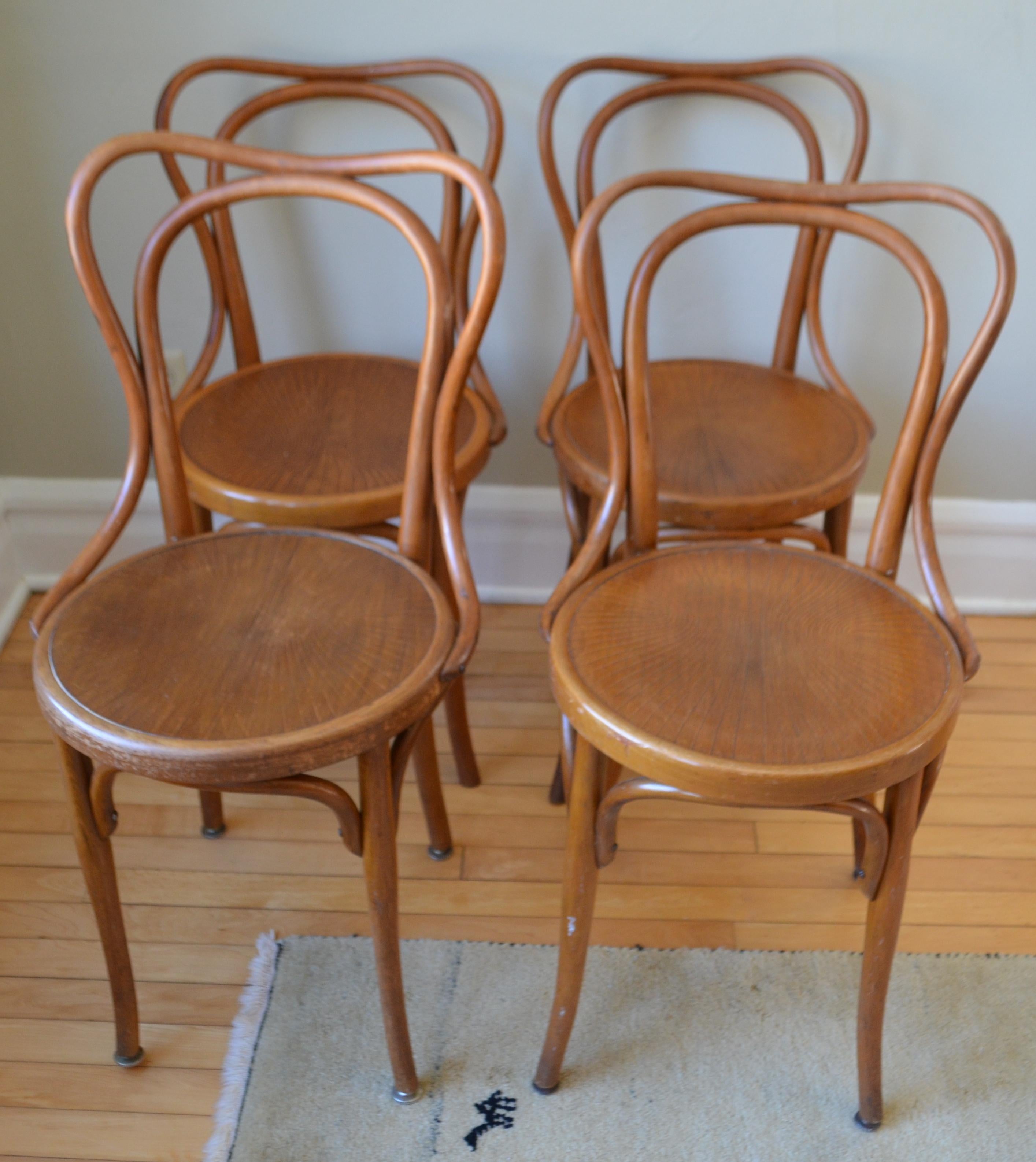 Bistro dining chairs from Jacob and Joseph Kohn. Made from bentwood beech with pressed seats. Date from the early 1900s. All in good original vintage condition, with some signs of wear to the embossed seats. They retain the original finish, nicely