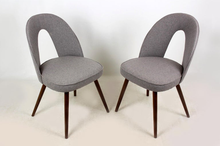 Set of two chairs produced circa 1960 in former Czechoslovakia and designed by Antonin Suman for Tatra. Upholstered with new grey fabric upholstery.