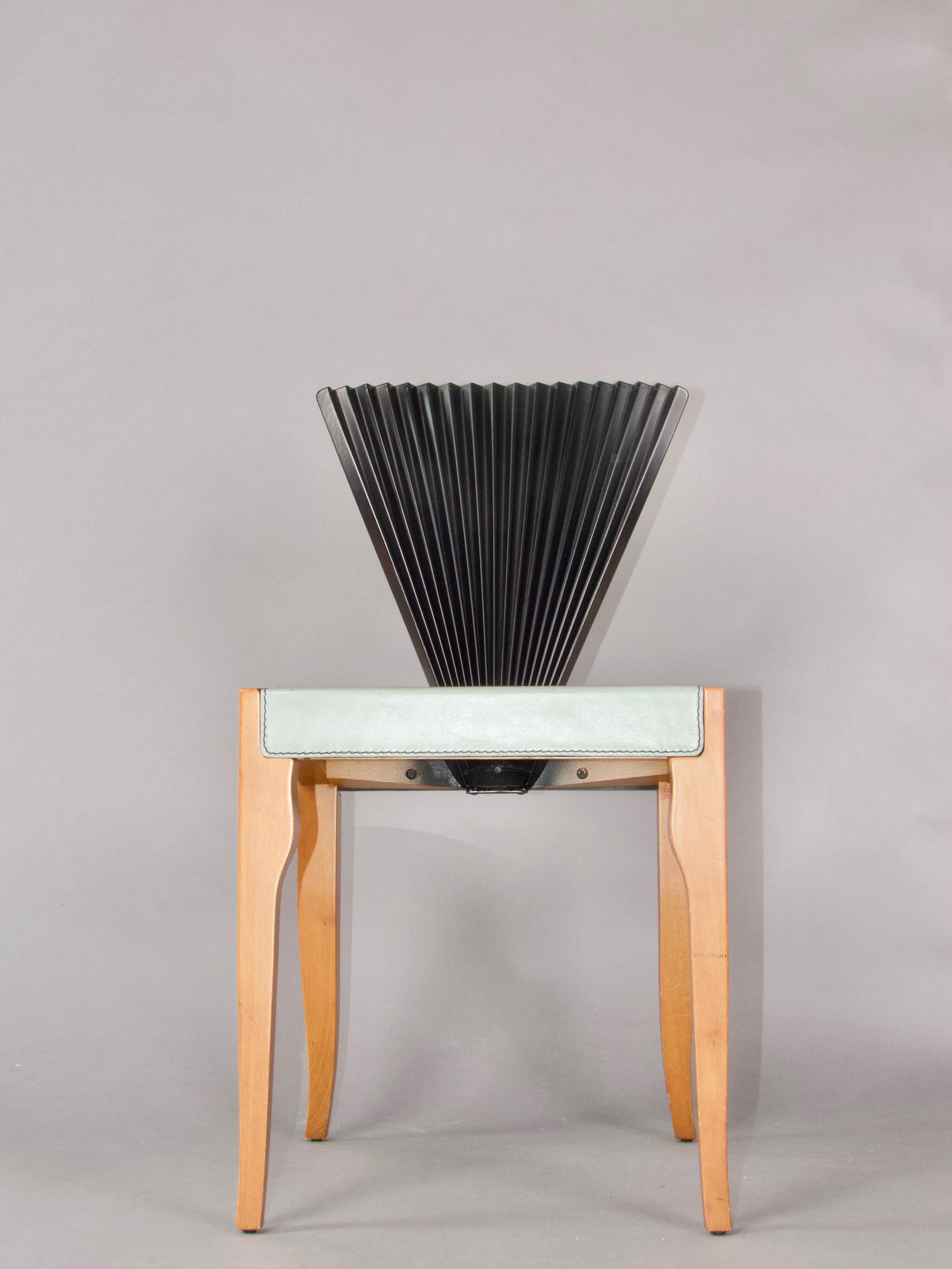 Fan' chair designed by Emanuele Zenere, a Postwar & Contemporary artist for the luxury Italian manufacturer Cattelan Italia, brand known for producing cutting edge, luxury designer furniture. Encompassed by quality materials, attention to detail and