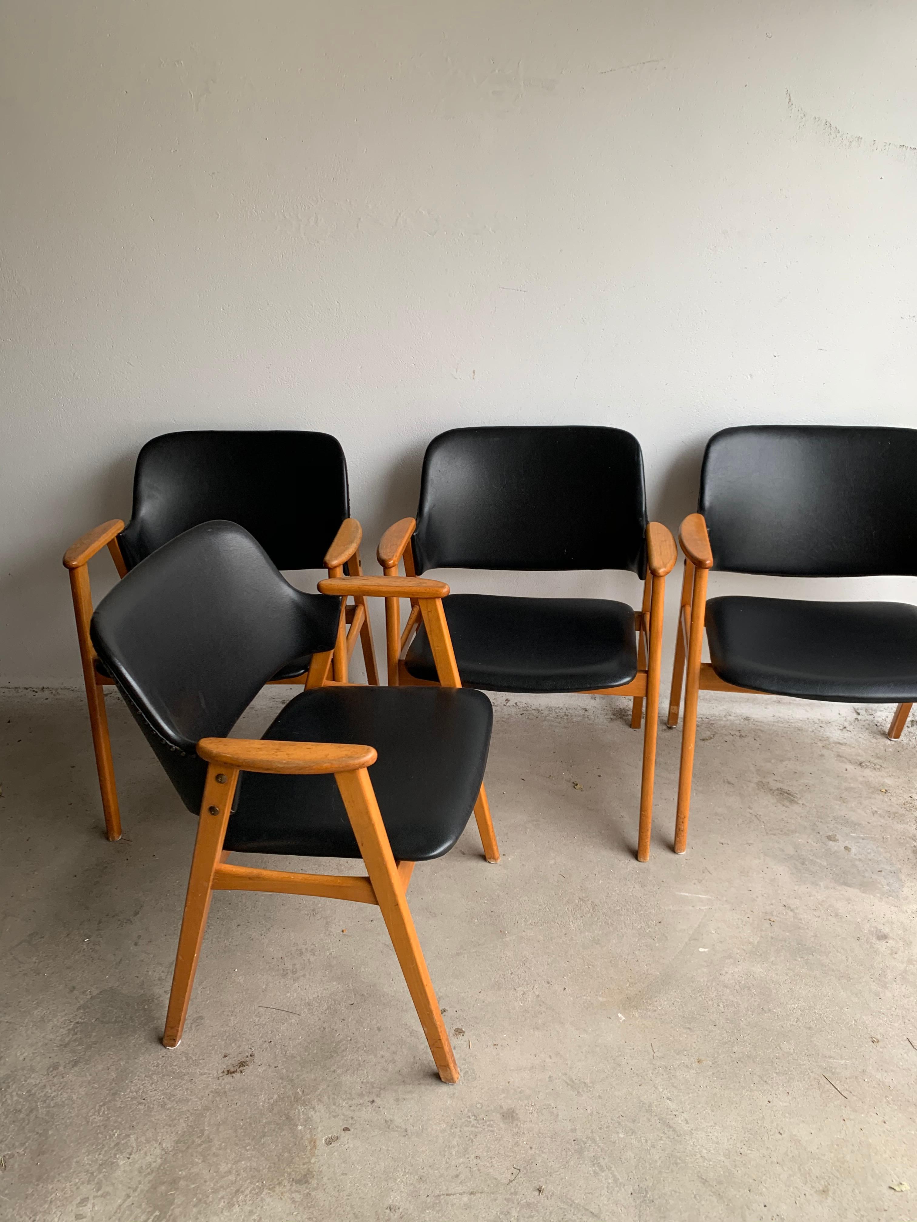 This set of four dining chairs was designed by Cees Braakman and manufactured by Pastoe in the Netherlands in the 1950s. The chairs feature birch frames and original black Skai upholstery. Chairs are in very good original condition. We can