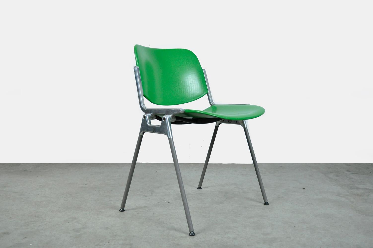 Designer chairs, type DSC Axis 106, designed in the 1960s by Giancarlo Piretti for Castelli, Italy. The 10 chairs have green plastic upholstery, aluminum frame, steel legs with gray plastic sleeves and black plastic feet. 