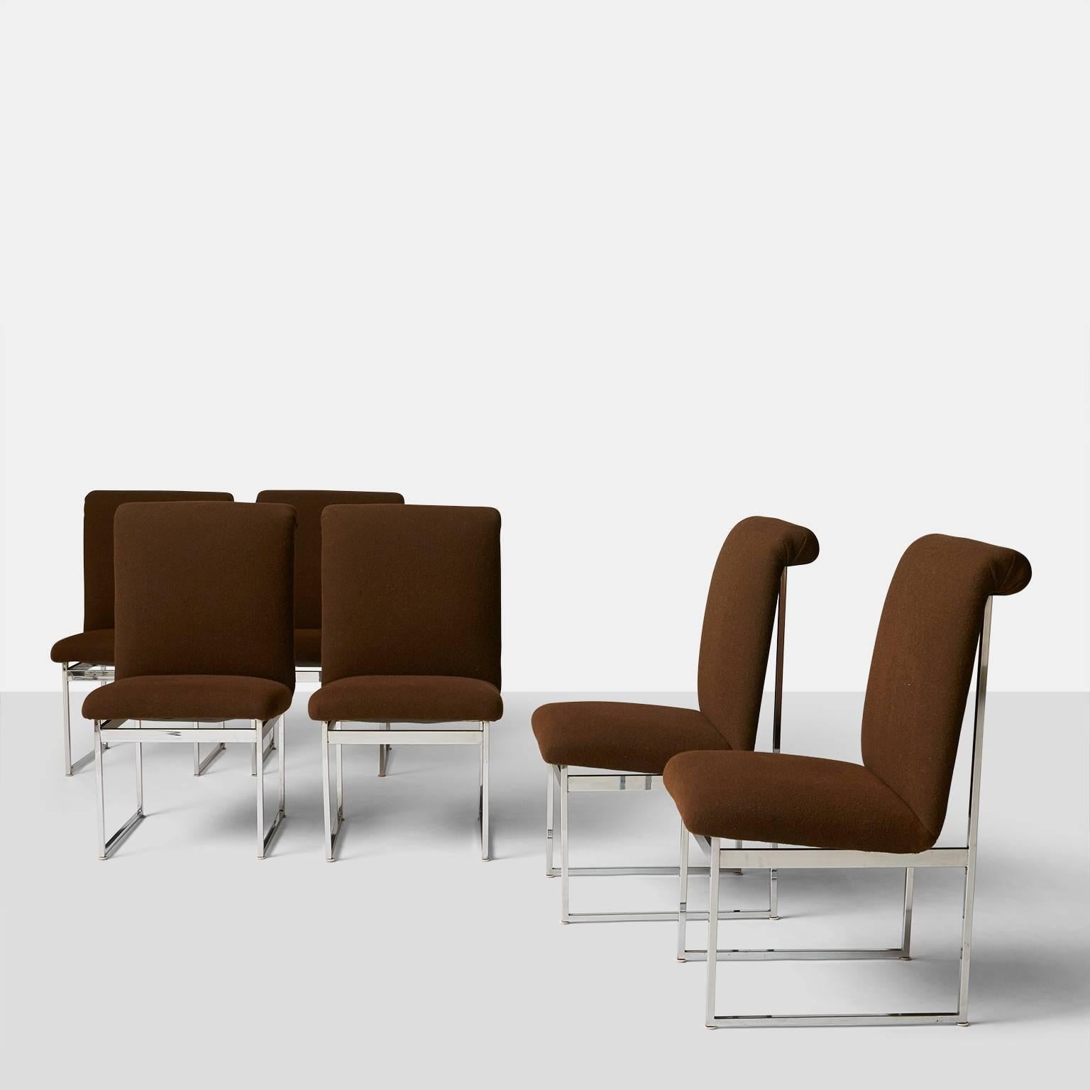 A set of six high back dining chairs in chromed steel and chocolate brown wool upholstery. The seat slants back slightly for extra comfort while the back has a rolled detail at the top. Made in the 1970s.