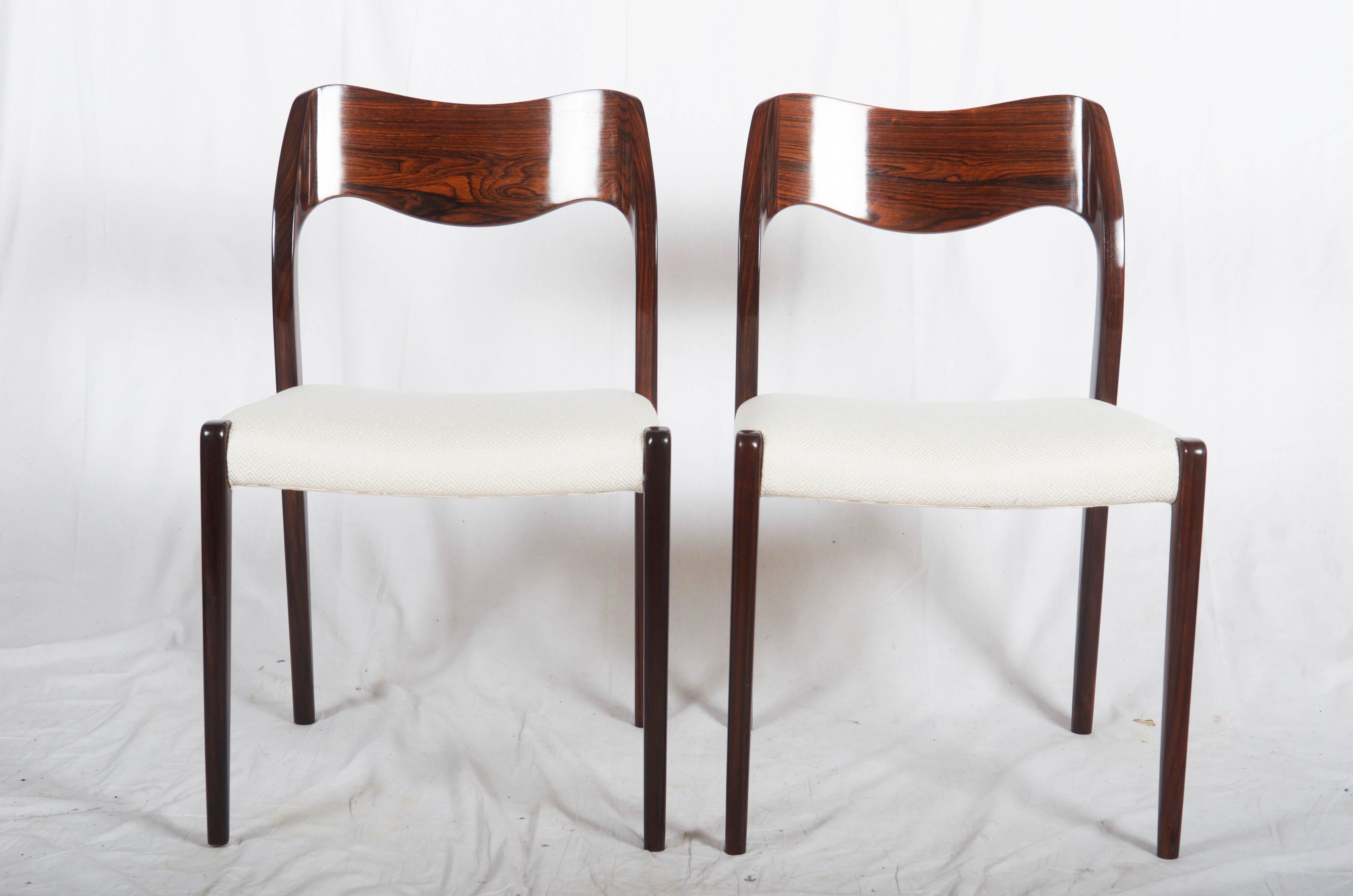 Dining chairs made of hardwood, designed 1951 by Niels Otto Møller and produced by J. L. Møller Møbelfabrik, model number 71. Excellent restored with new upholstered. (Another fabric or leather of course possible) Up to 18 available, delivery time