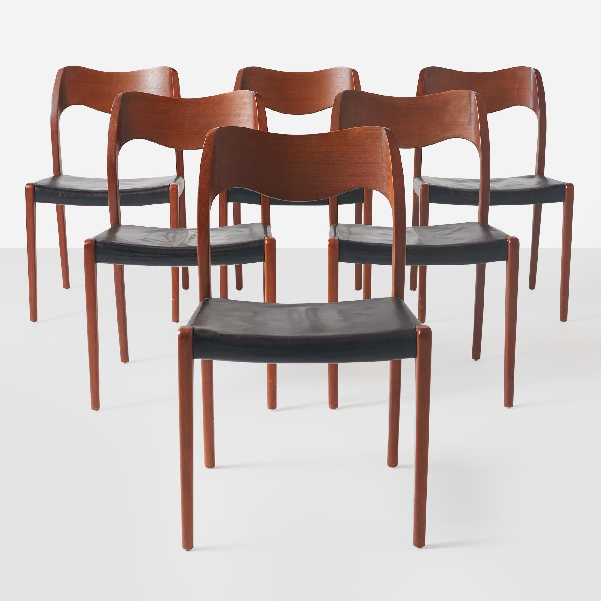 A set of 6 dining chairs by designer Niels O. Moller (#71) in teak with black leather seats.