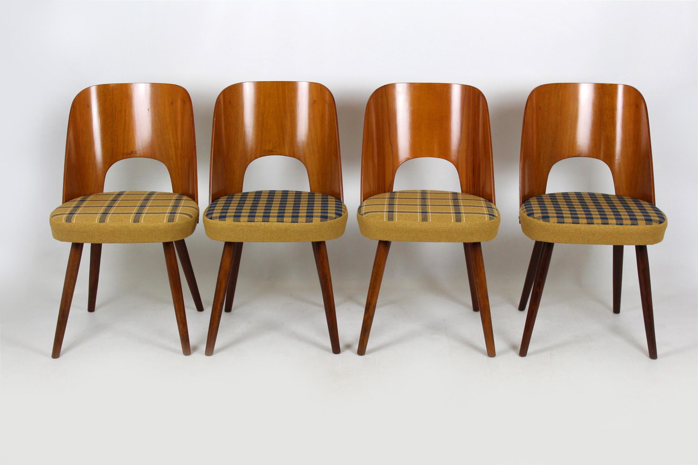 Set of four chairs from Tatra. Designed by Oswald Haerdtl and produced in 1960s in former Czechoslovakia. Backrests made of veneered bent plywood. Seats reupholstered in checkered fabric.