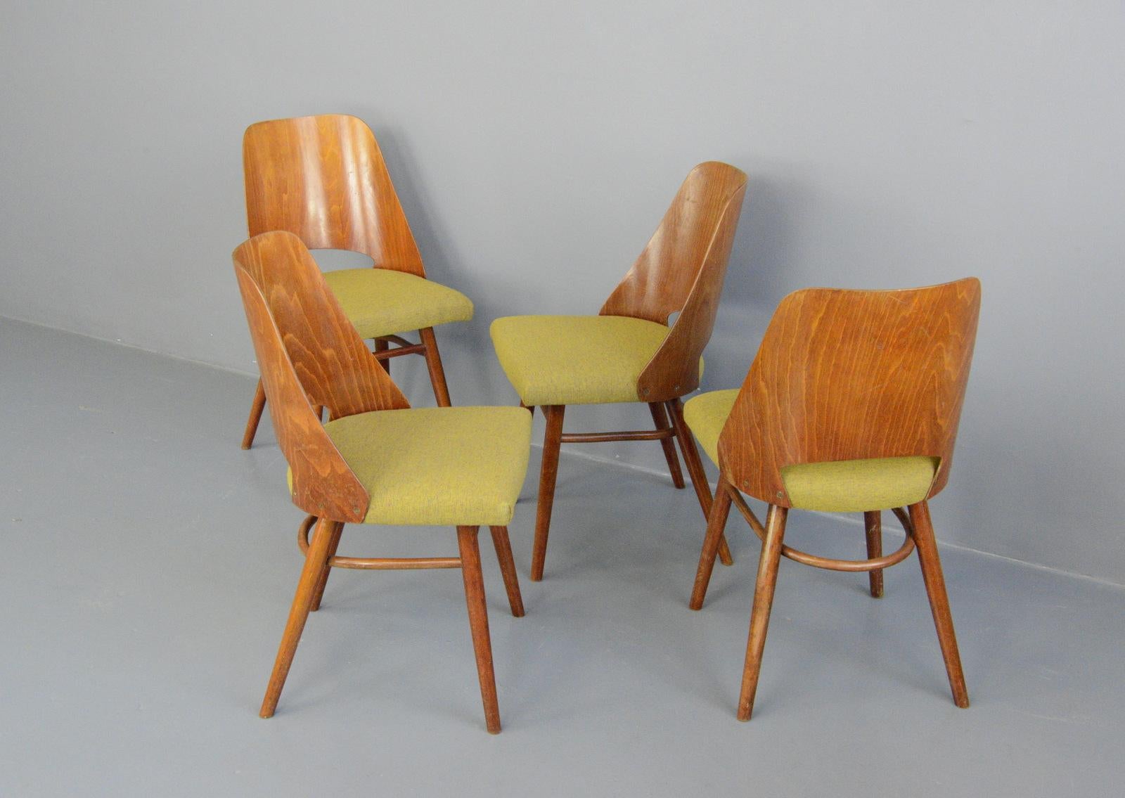 Dining chairs by Oswald Haerdtl for Ton, circa 1960s

- Price is for the set of 4
- Shaped ply back rests
- Beech frame
- New mustard upholstery
- Designed by Oswald Haerdtl
- Produced by Ton
- Czech ~ 1960s
- 43cm wide x 43cm deep x 80cm