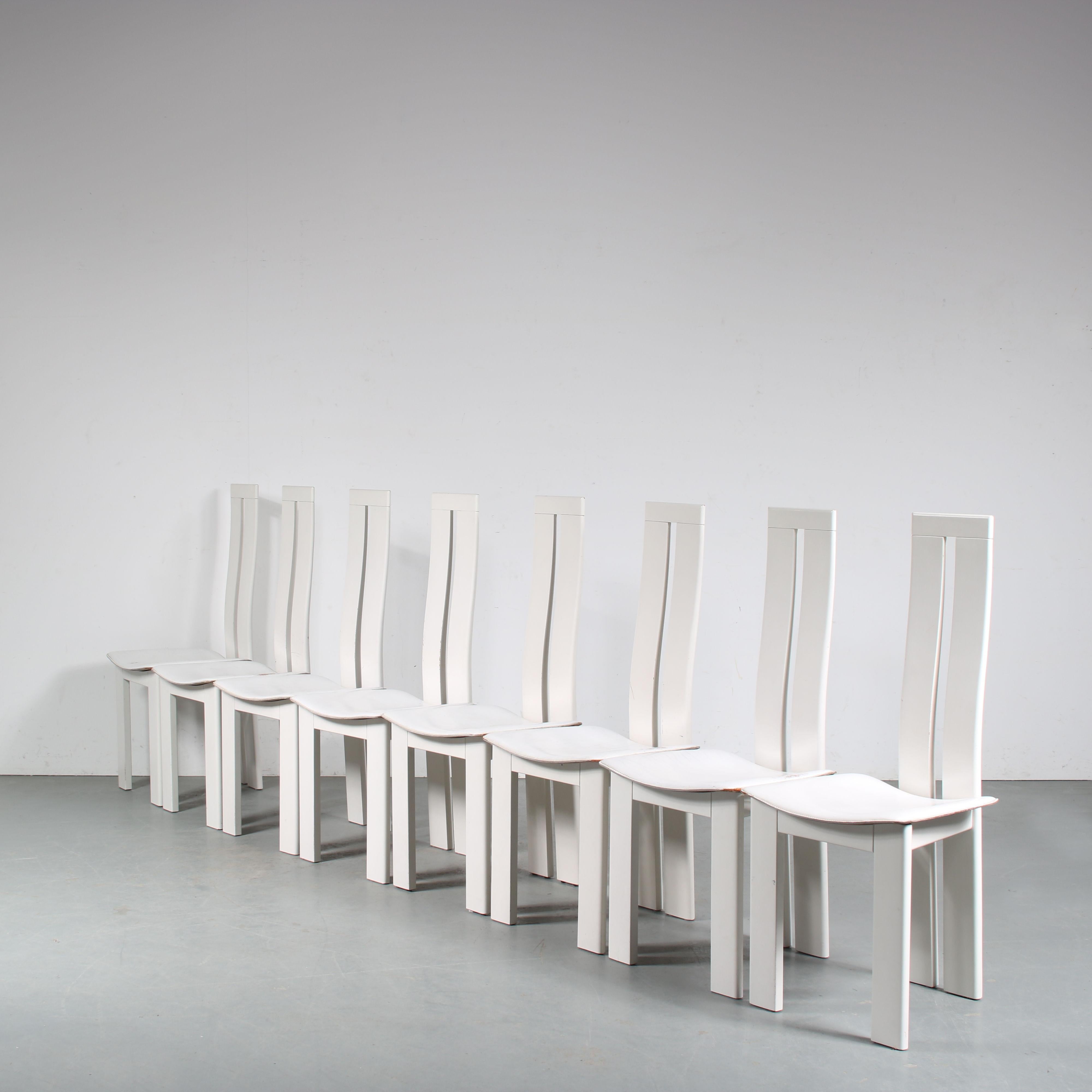 An eye-catching set of eight dining chairs designed by Pietro Costantini, manufactured by Ello in Italy around 1980.

The chairs are made of white lacquered wood, which makes them suitable for many different styles of interior! The chairs have tall