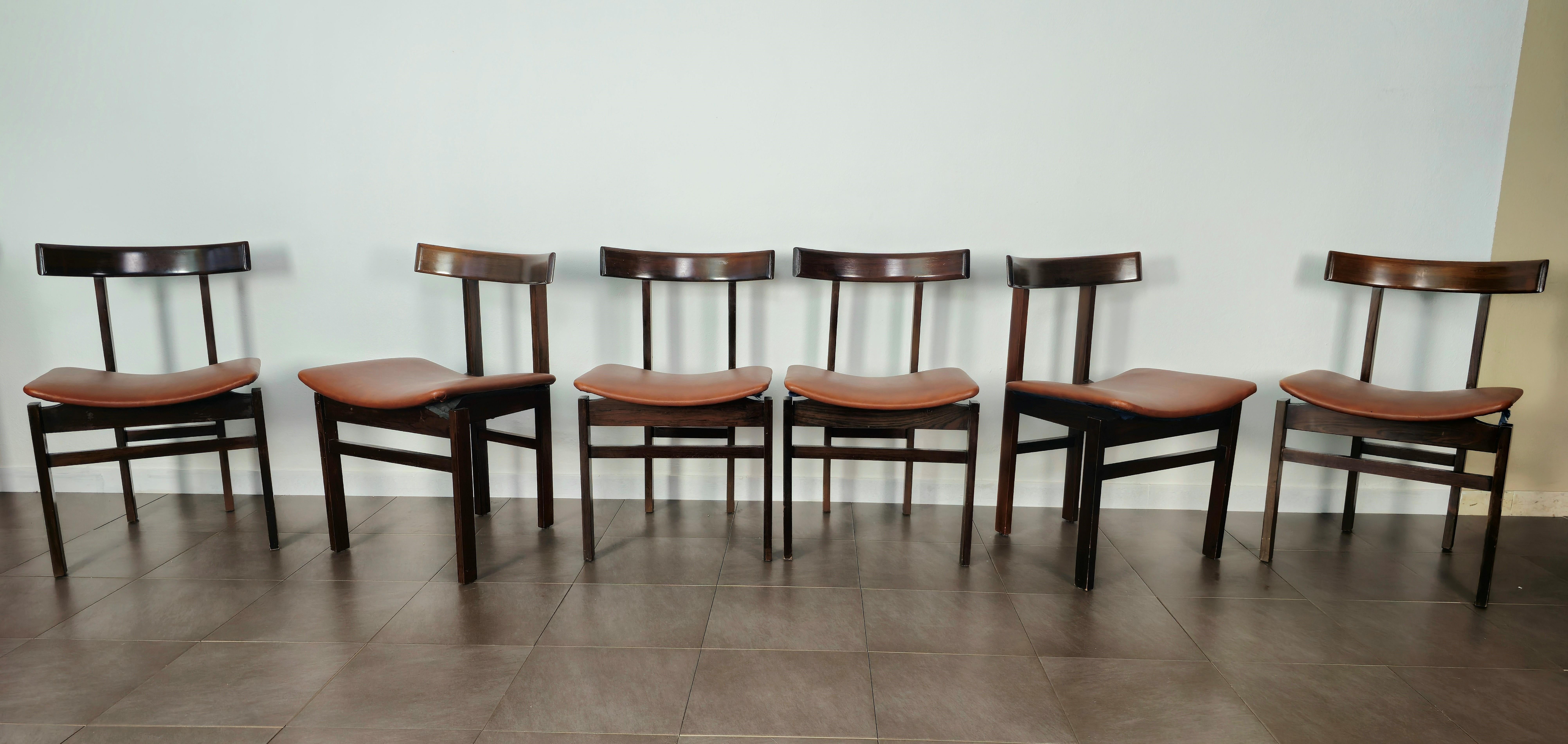 Set of 6 Danish-made dining chairs. Designed by designer Inger Klingenberg and produced in the 60s by France & Son.
Every single chair was made of wood with a leather seat in shades of brown. the particularity of each chair is given by the back and