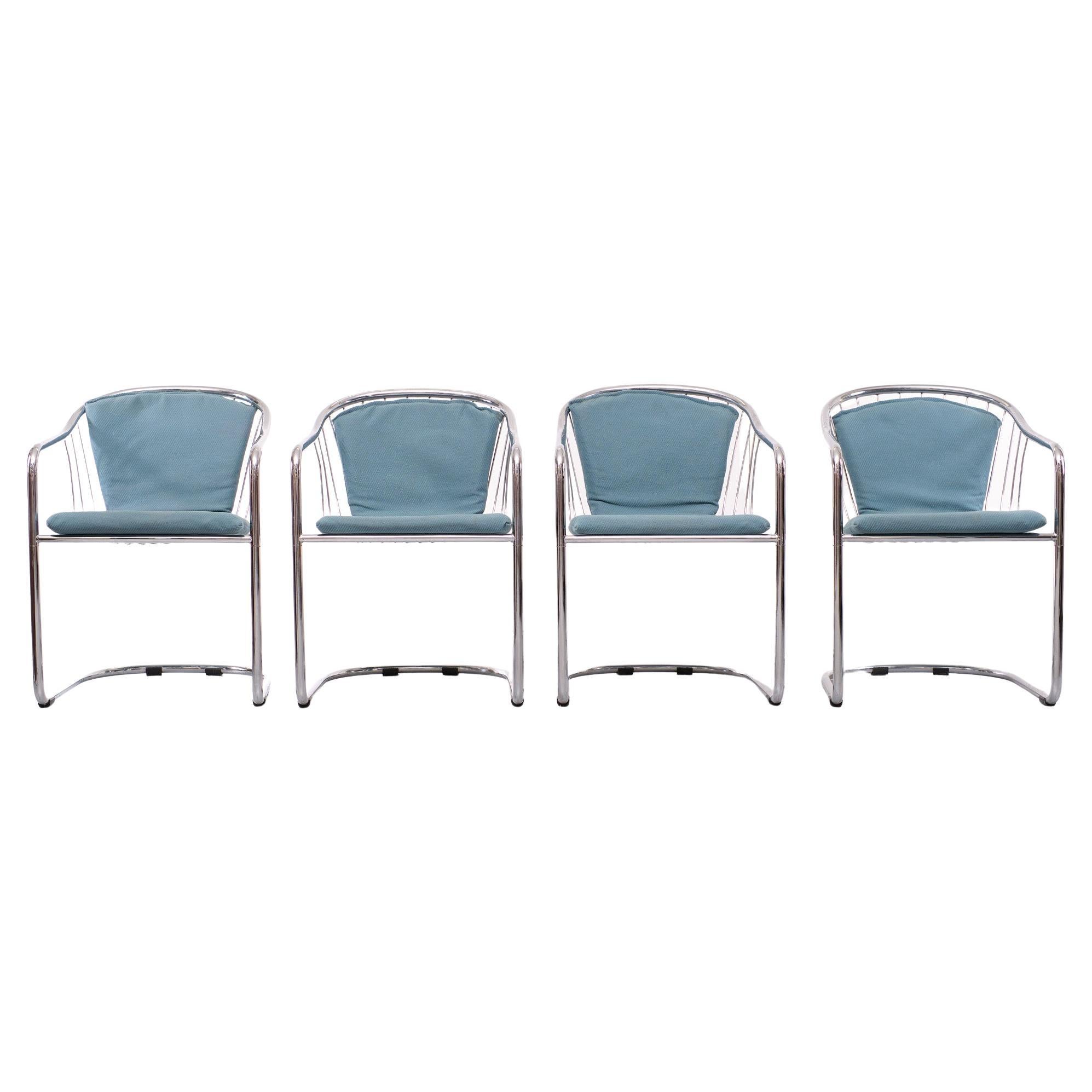 Set off 4 Gastone Rinaldi dining chairs for Rima Italy 1n the 1970s. Chrome 
on metal tube frame, comes with the original used Blue fabric upholstery. 
However, the chairs can also be used without the original upholstery.
 