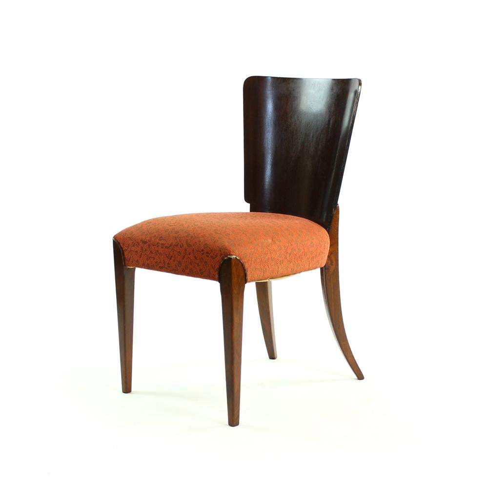 Set of four beautiful dining chairs type H-214 designed by Jindrich Halabala and manufactured in UP Zavody. Unique and interesting. The chairs are made with straight front legs. The back legs are curved, shaped in a sword-like fashion. The backrest