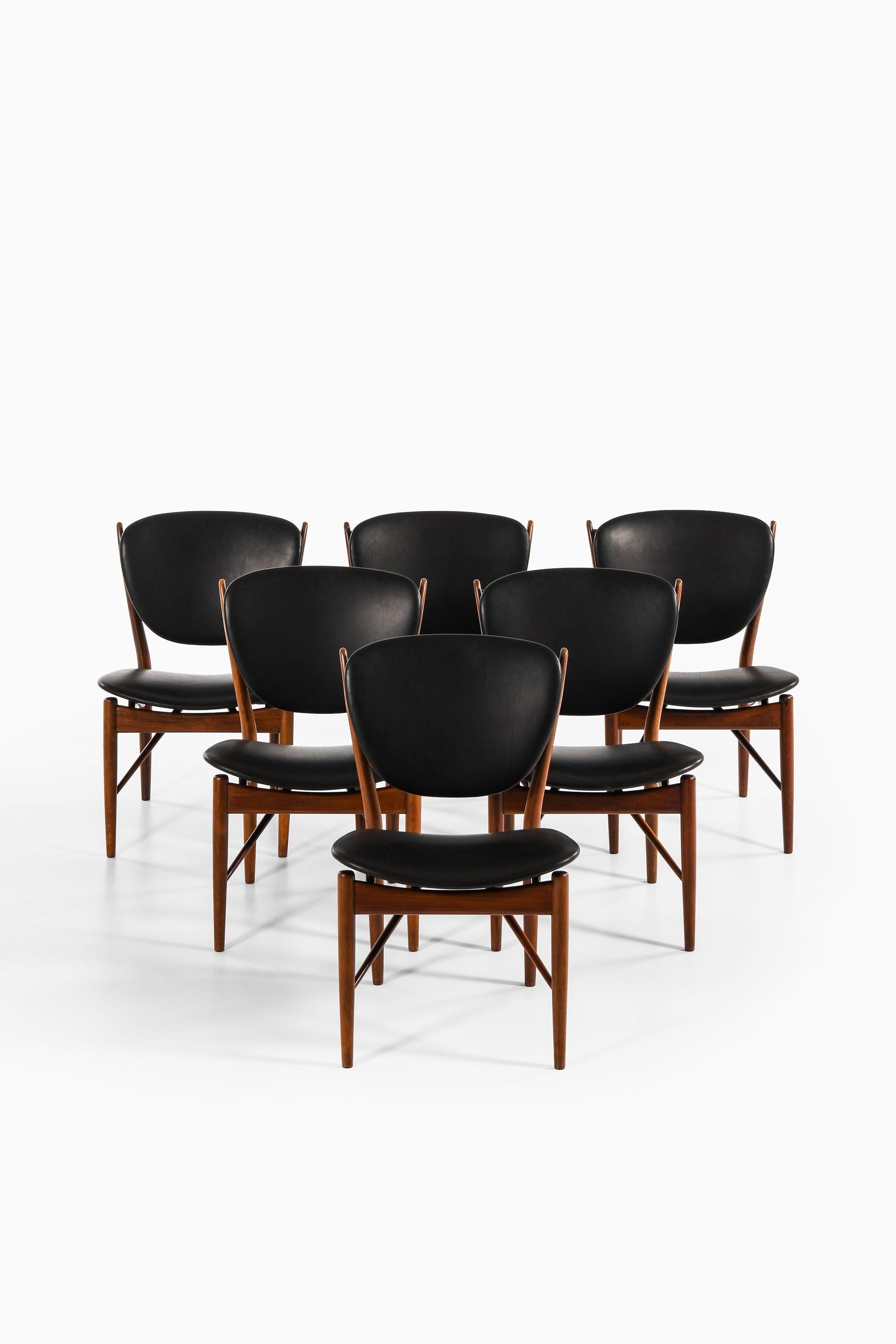 Dining Chairs in Rosewood and Black Leather by Finn Juhl, 1951

Additional Information:
Material: Rosewood and black leather
Very rare dining chairs model FJ-51
Produced by cabinetmaker Niels Vodder in Denmark
Dimensions (W x D x H): 55.5 x 56 x 81
