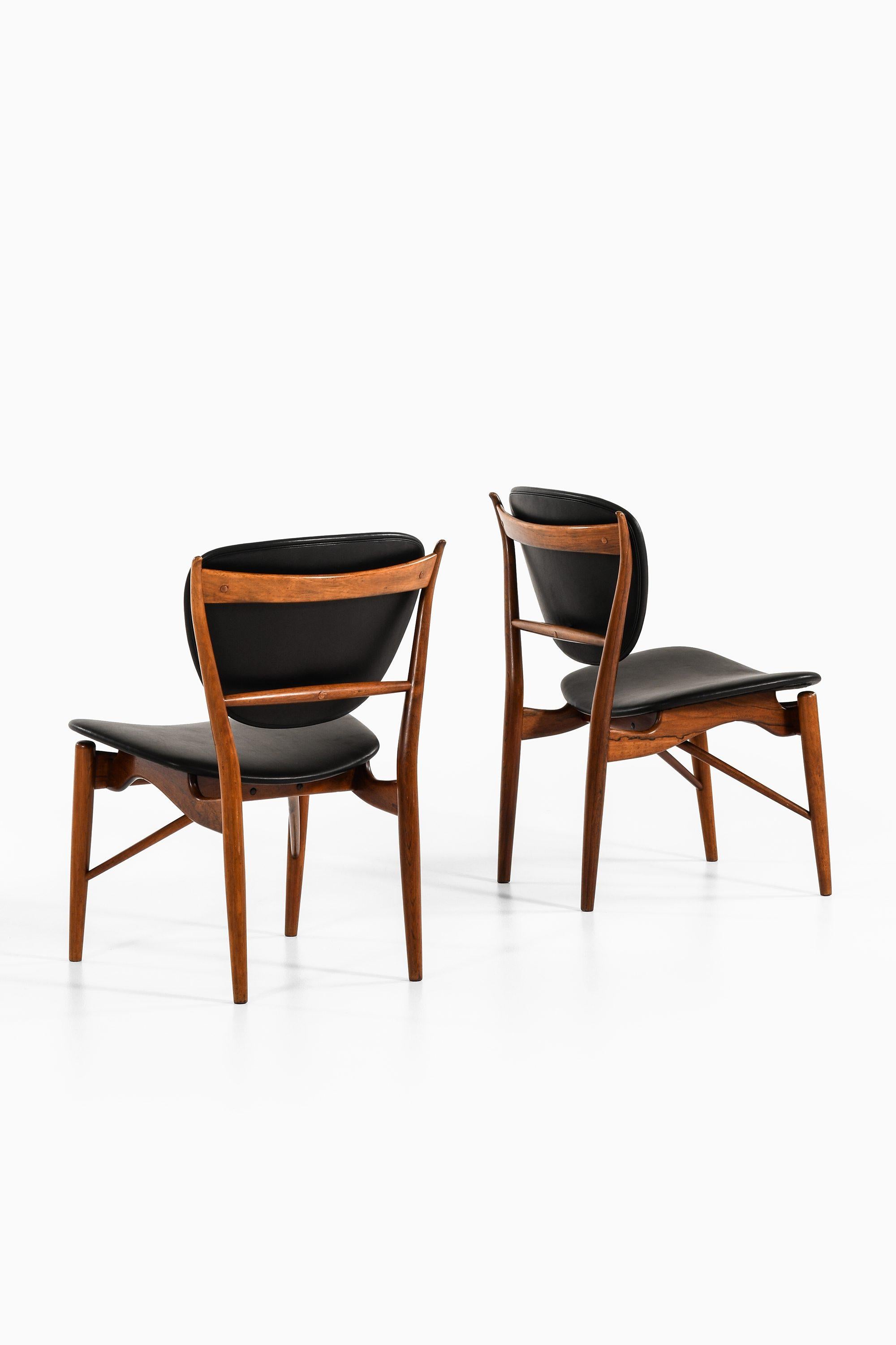 20th Century Dining Chairs in Rosewood and Black Leather by Finn Juhl, 1951 For Sale