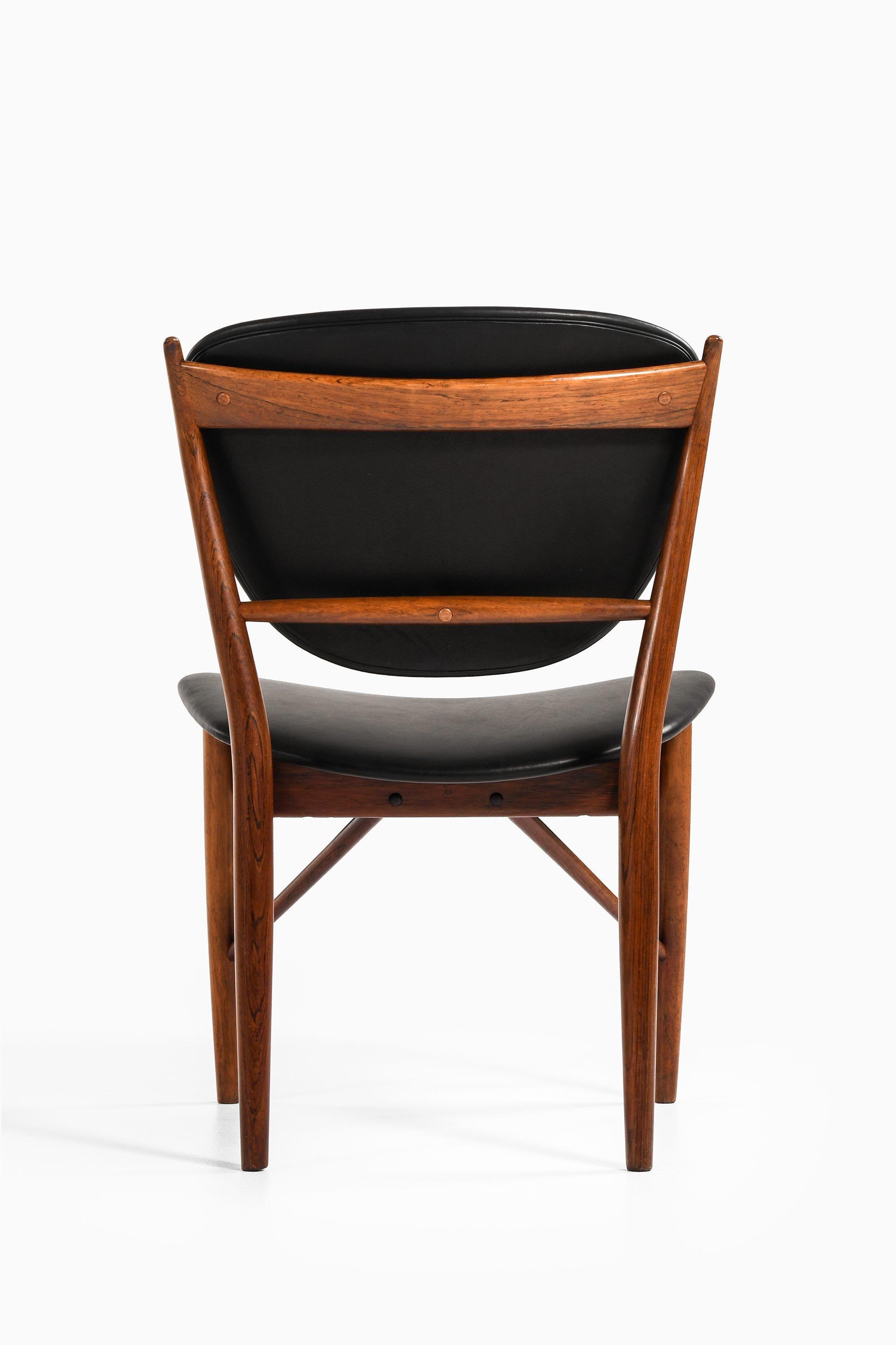 Dining Chairs in Rosewood and Black Leather by Finn Juhl, 1951 For Sale 1