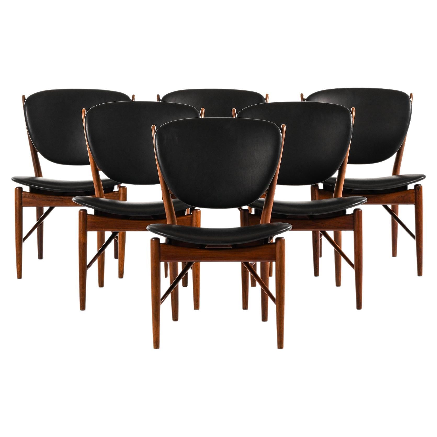 Dining Chairs in Rosewood and Black Leather by Finn Juhl, 1951