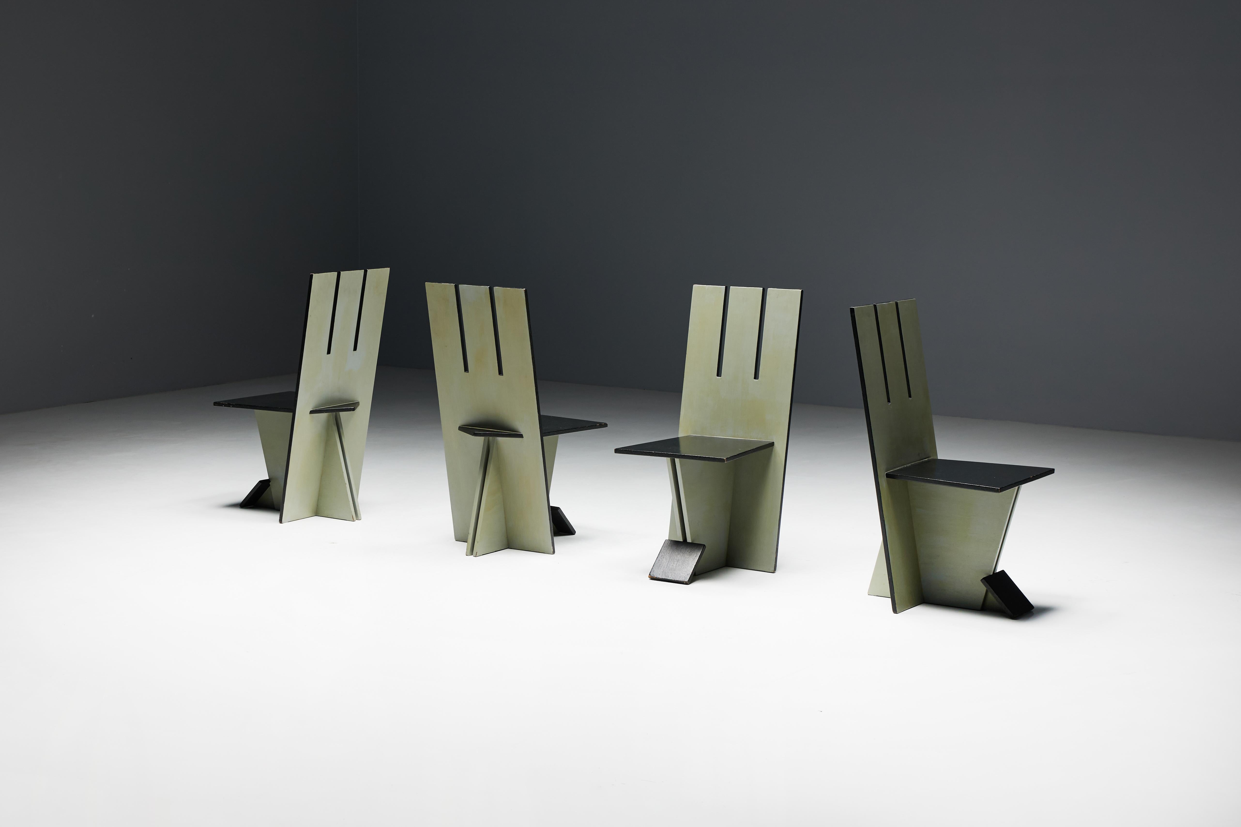 Set of 4 dining chairs, echoing the visionary spirit of the De Stijl movement of the 1930s and inspired by the pioneering works of Vilmos Huszar and Piet Zwart. Constructed from painted wood, these chairs exhibit meticulous attention to detail,