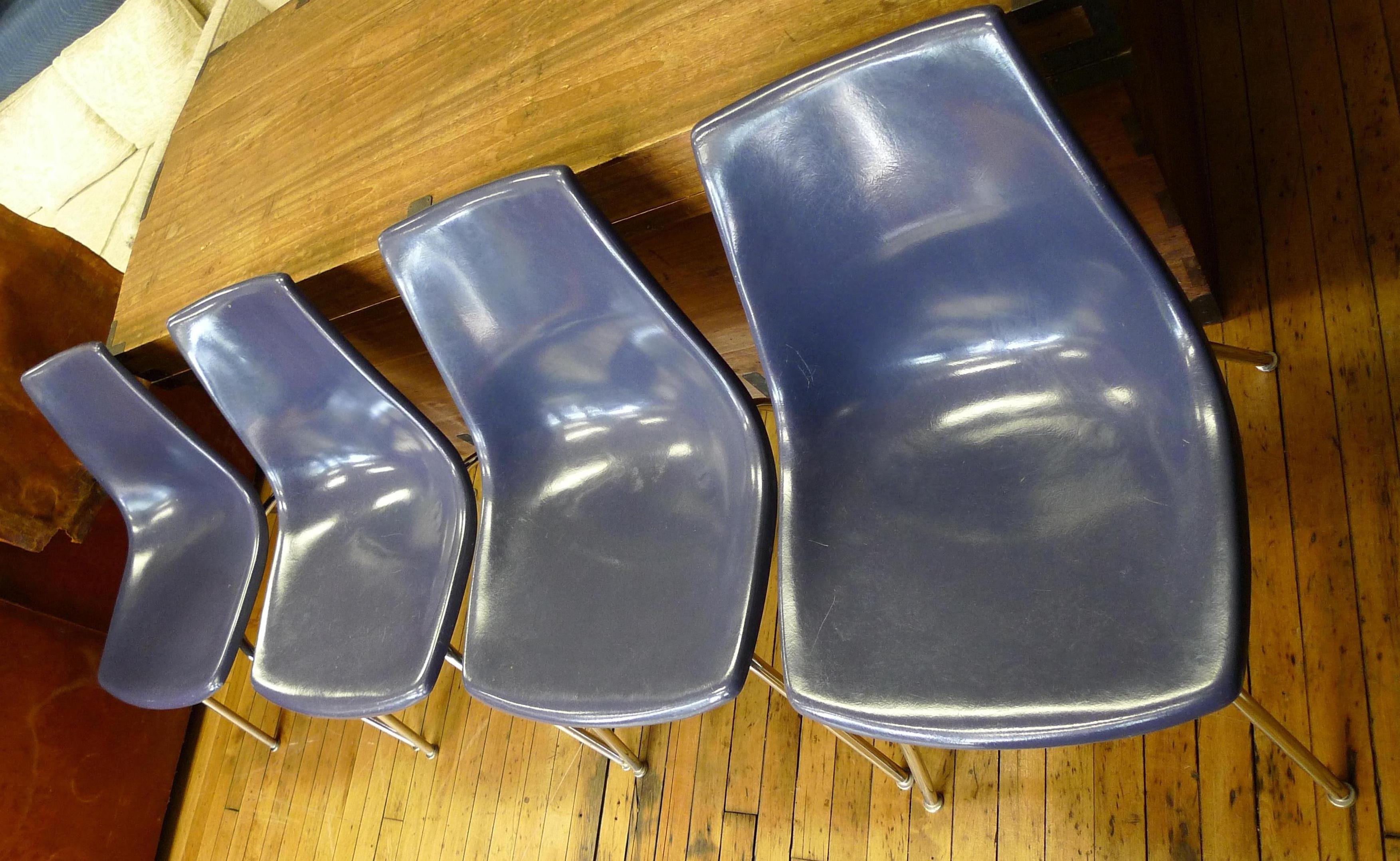 Dining chairs of blue fiberglass with chrome frames from Kreuger International. Set of 4. This set of chairs offers sitting comfort within a minimalist footprint. Lightweight yet sturdy with sea-and-sky blue coloration. Use for dining, for smaller