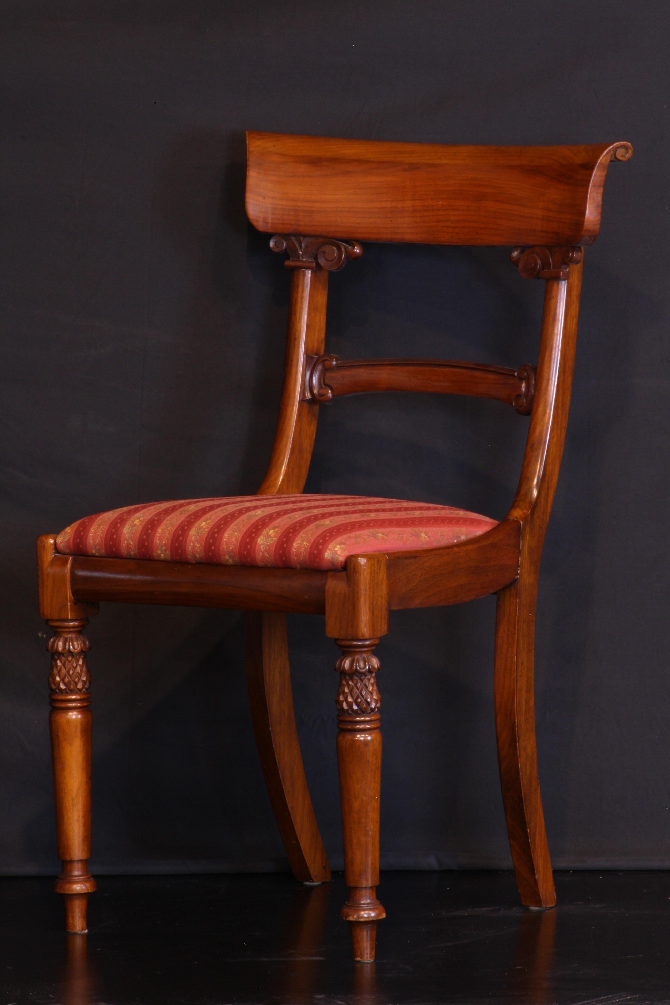 Dining chairs walnut 1 arm and 11 side chairs 19th century styling made by Lionel Rawlinson 
pop off seats so upholstery can be easily changed. Solid sturdy chairs.