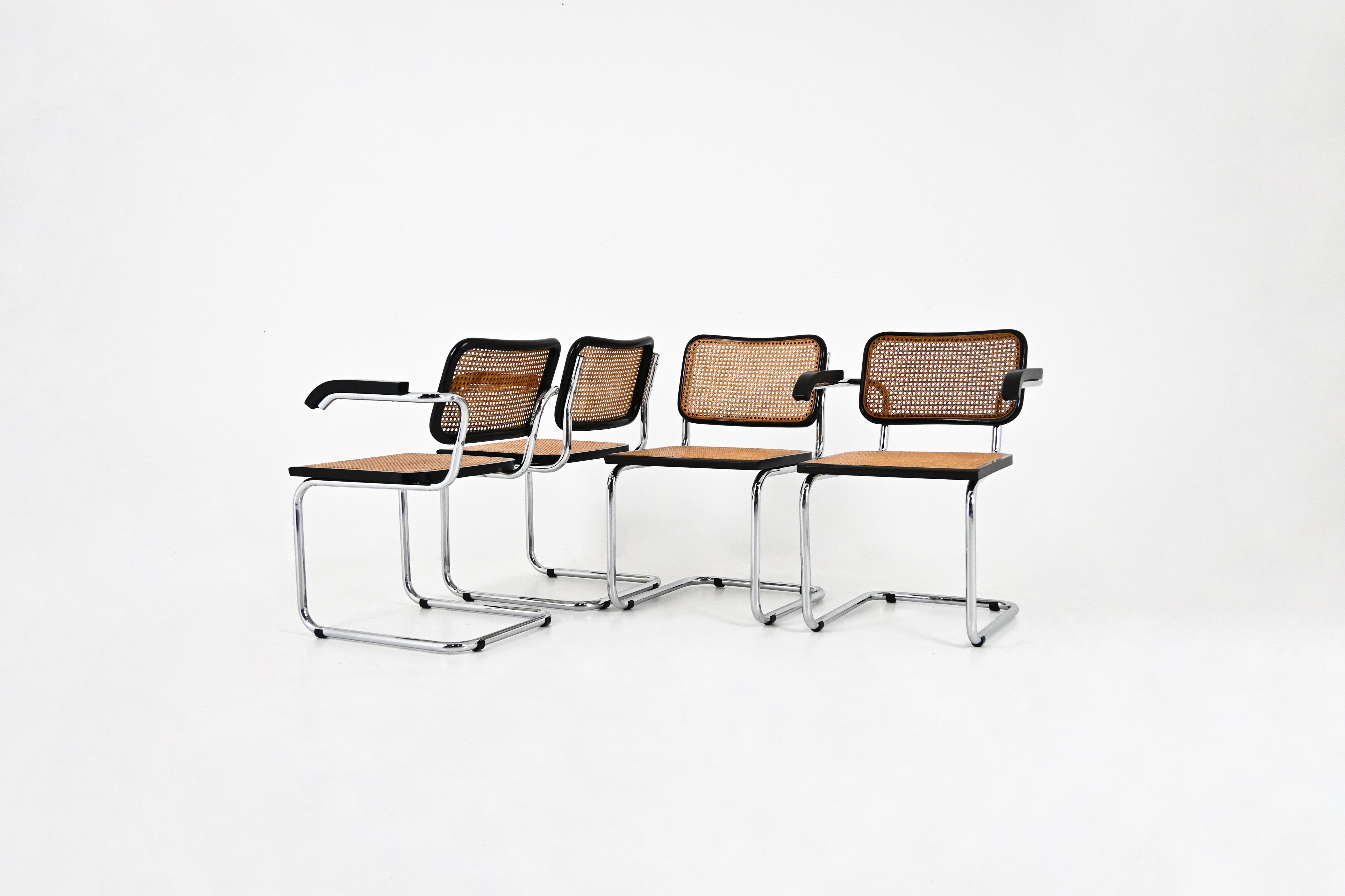 Set of 4 chairs in metal, wood and rattan. 
Dimensions: seat height: 45 cm. Width with armrests : 59 cm 
Wear due to time and age of the chairs. 
FOR SHIPPING, REQUEST US FOR RECEIVE THE BEST PRICE



