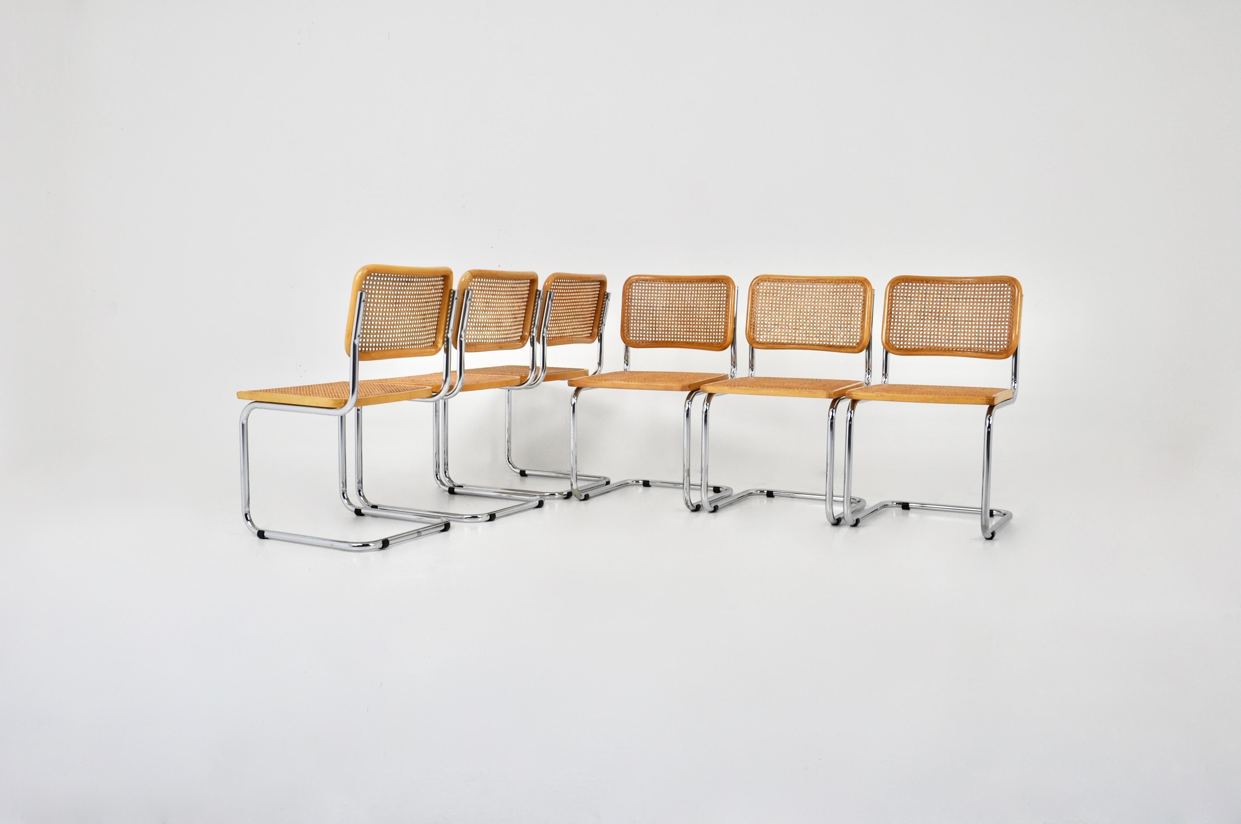 Set of 6 chairs in metal, wood and rattan. Dimensions: seat height: 44 cm. Wear due to time and age of the chairs. Sold by 6, the set cannot be divided.
 