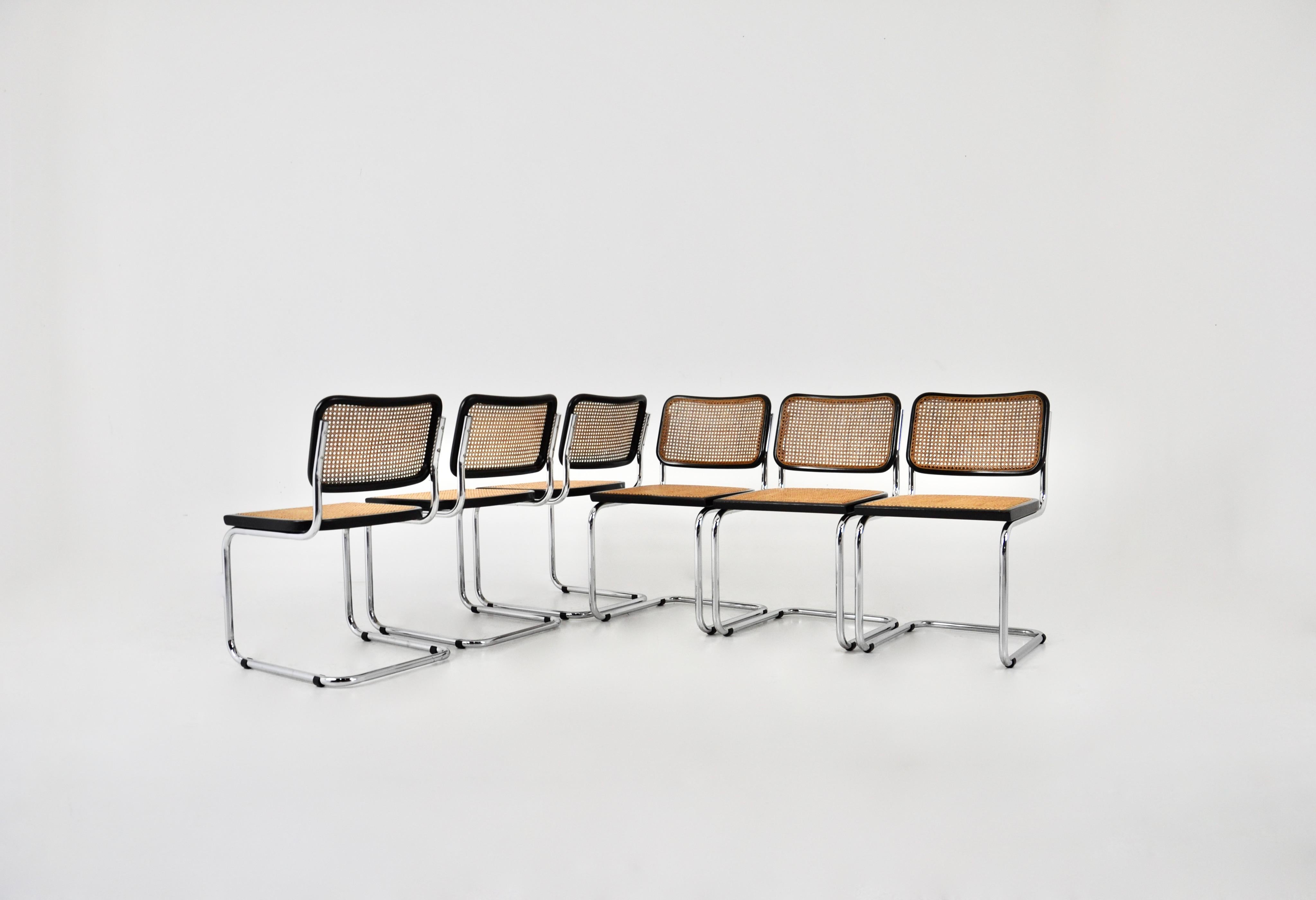 Set of 6 chairs in metal, wood and rattan. Dimensions: seat height: 46 cm. Wear due to time and age of the chairs. Sold by 6, the set cannot be divided.