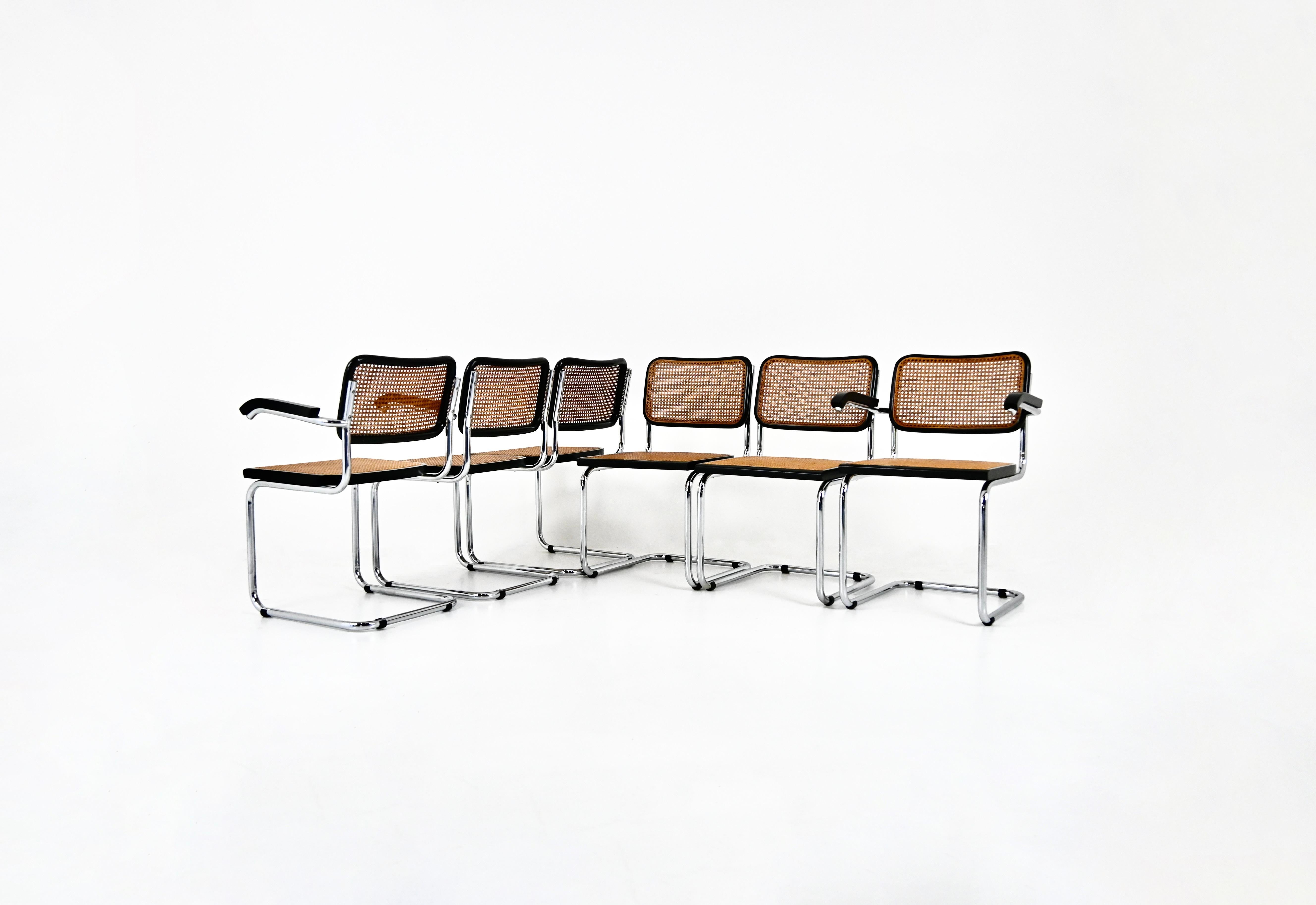 Set of 4 chairs in  black metal, wood and rattan. 
Dimensions: seat height: 45 cm. Width with armrests : 63 cm 
Wear due to time and age of the chairs. 
FOR SHIPPING, REQUEST US FOR RECEIVE THE BEST PRICE



