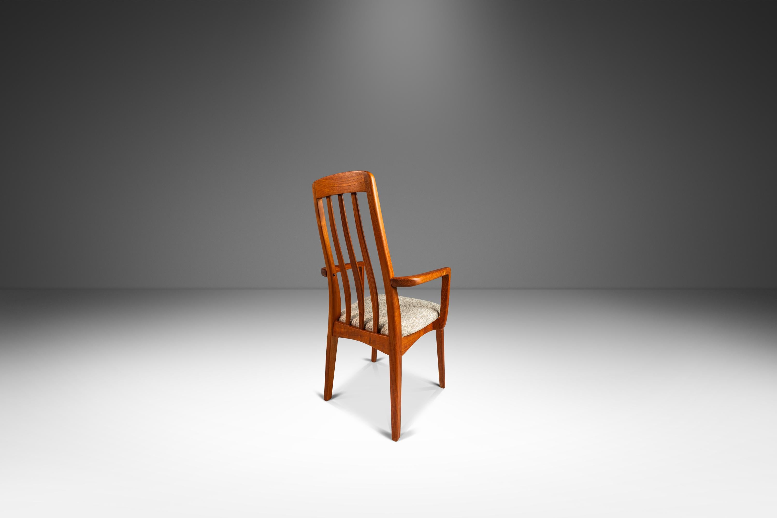 Introducing a beautifully sculpted Danish Modern teak side chair designed by Benny Linden for Benny Linden Design. This superbly crafted and sculpted modern teak dining chair with a curved backrest features new medium density foam for maximum