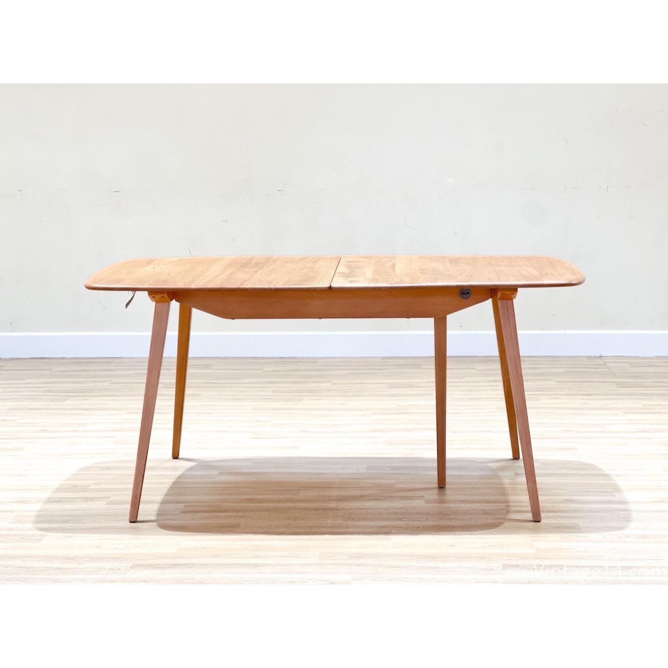 ucian Ercolani designed this table for Ercol in England in the ’60s. This is the Grand Windsor extending table model 444 Ercol made in the early ’60s.

The table is handcrafted in a beautiful elm; the feature of this elm is the beauty of the elmwood