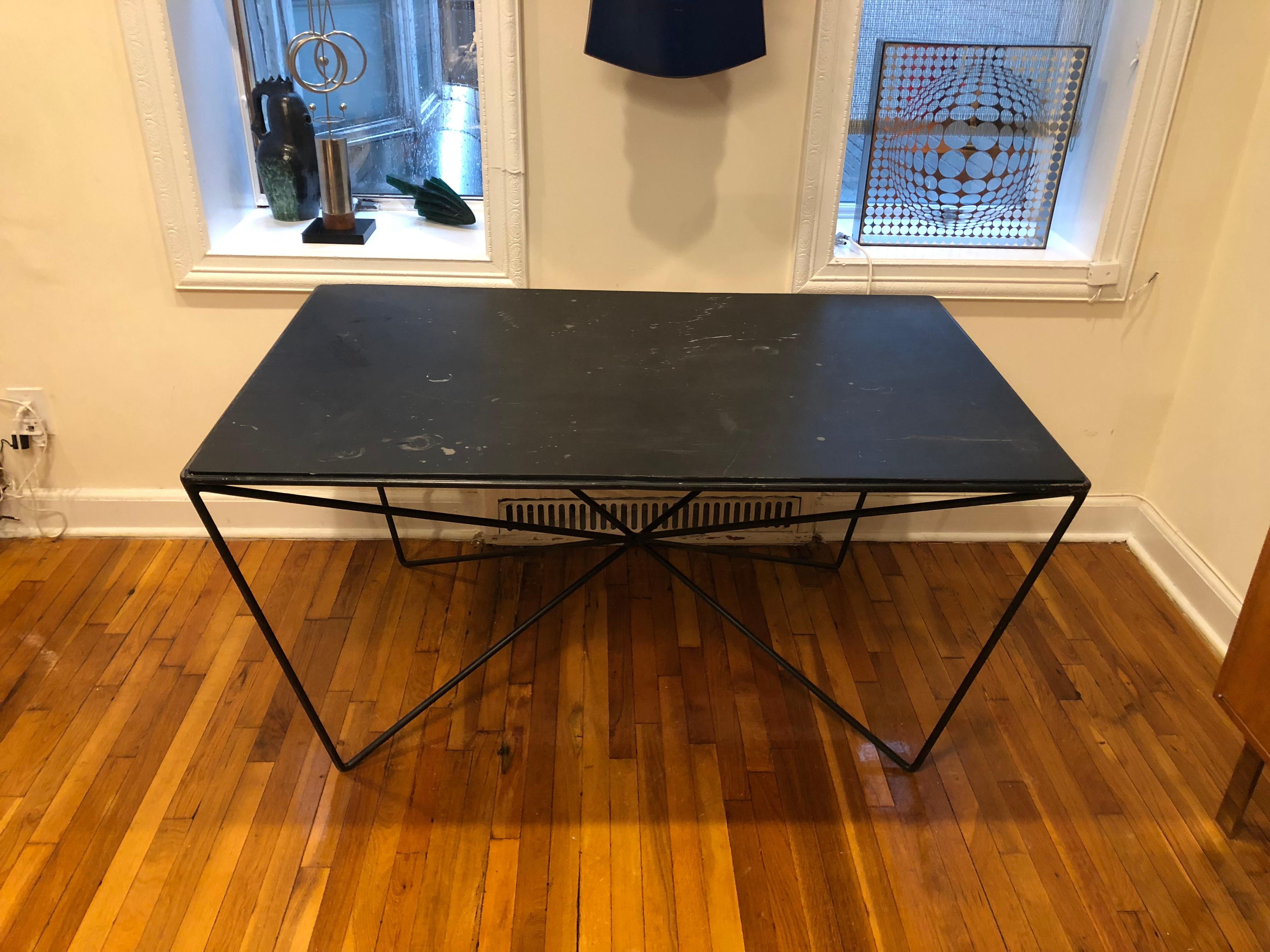 Black enameled tubular steel dining height table attributed to Darrell Landrum for Avard with an inset slate top. 
Height listed measures to the top of the slate.