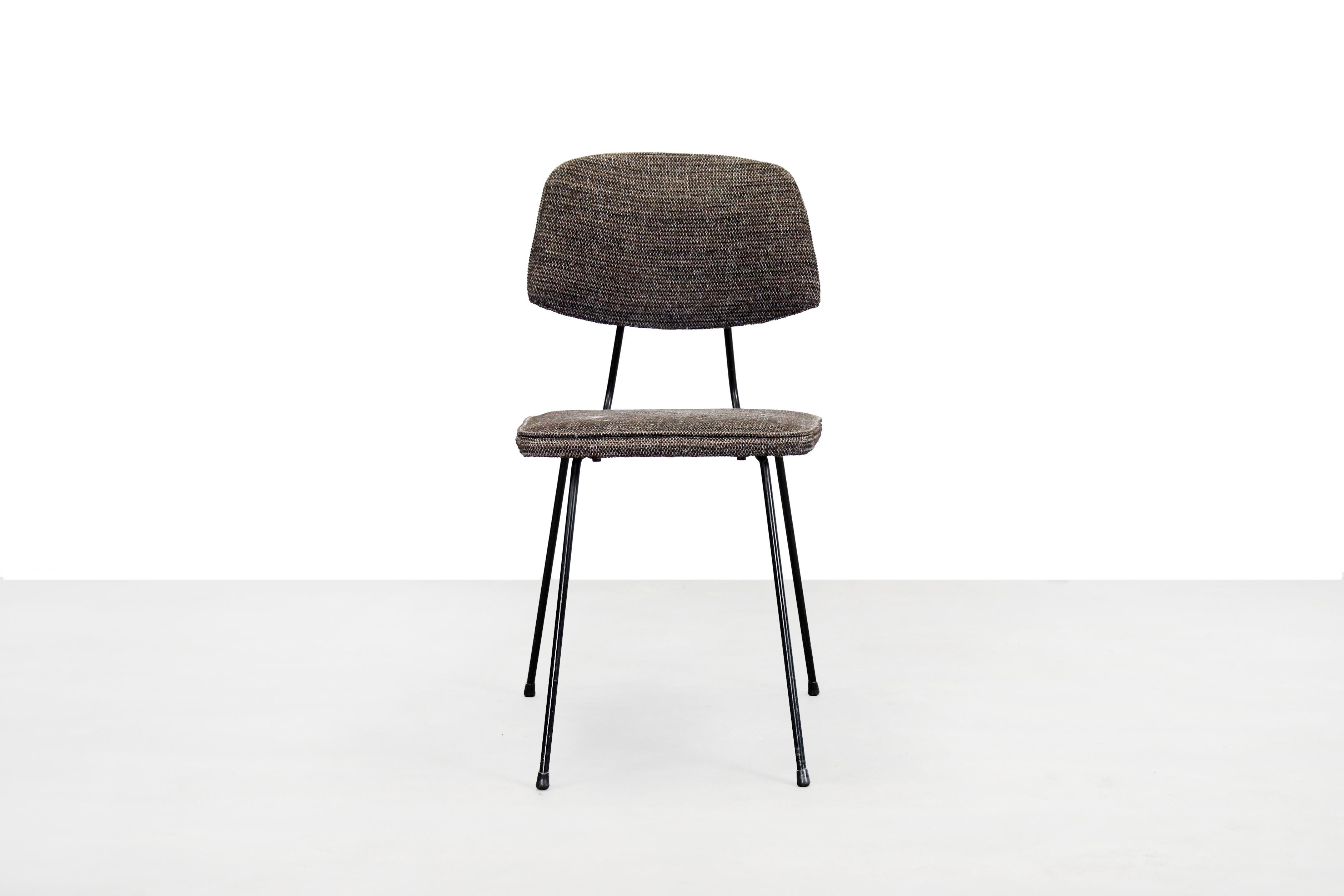 Great piece of Dutch Industrial design chair by Rudolf Wolf for Elsrijk. The frame is made of black painted metal and the chair has the original coarse wool upholstery. The color is brown mixed with black. The total height of the chair is 79 cm, the