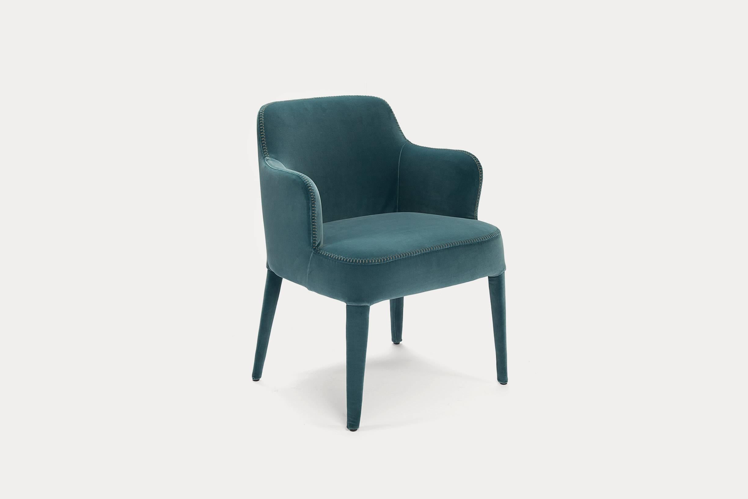 Febo high armchair in soft blue velvet with detailed stitching. The retail price on this chair is $1988, however it has been discounted due to the white fading marks on the seat.
      